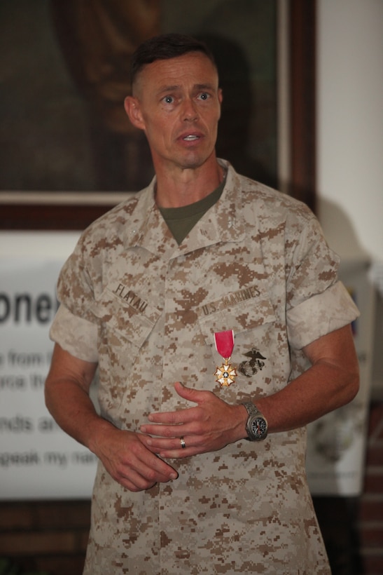 Col. Richard P. Flatau Jr., outgoing commanding officer of Marine Corps Base Camp Lejeune, thanks the audience for their support during a change-of-command ceremony at the Paradise Point Officers’ Club aboard the base, June 25.  Flatau is retiring from the Marine Corps after 27 years of active-duty service and is replaced by Col. Daniel J. Lecce, who most recently served as the staff judge advocate for 2nd Marine Aircraft Wing, Marine Corps Air Station Cherry Point.