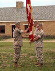 FORT SNELLING, MINN.—Maj. Kenneth C. Gawronski, the incoming Commanding Officer of Recruiting Station Twin Cities, hands the station’s organizational colors back to SgtMaj James C. Kirkland, the sergeant major for Recruiting Station Twin Cities, during a change of command ceremony held on the grounds of Historic Fort Snelling, June 25. The Battle Colors of a Marine Corps Unit symbolize the authority and accountability of command. The passing of the colors from one commanding officer to another signifies the relinquishing and acceptance of command and confirms the commanding officer’s total commitment to the Marines he will command. Photo by Staff Sgt. Stephen L. Traynham