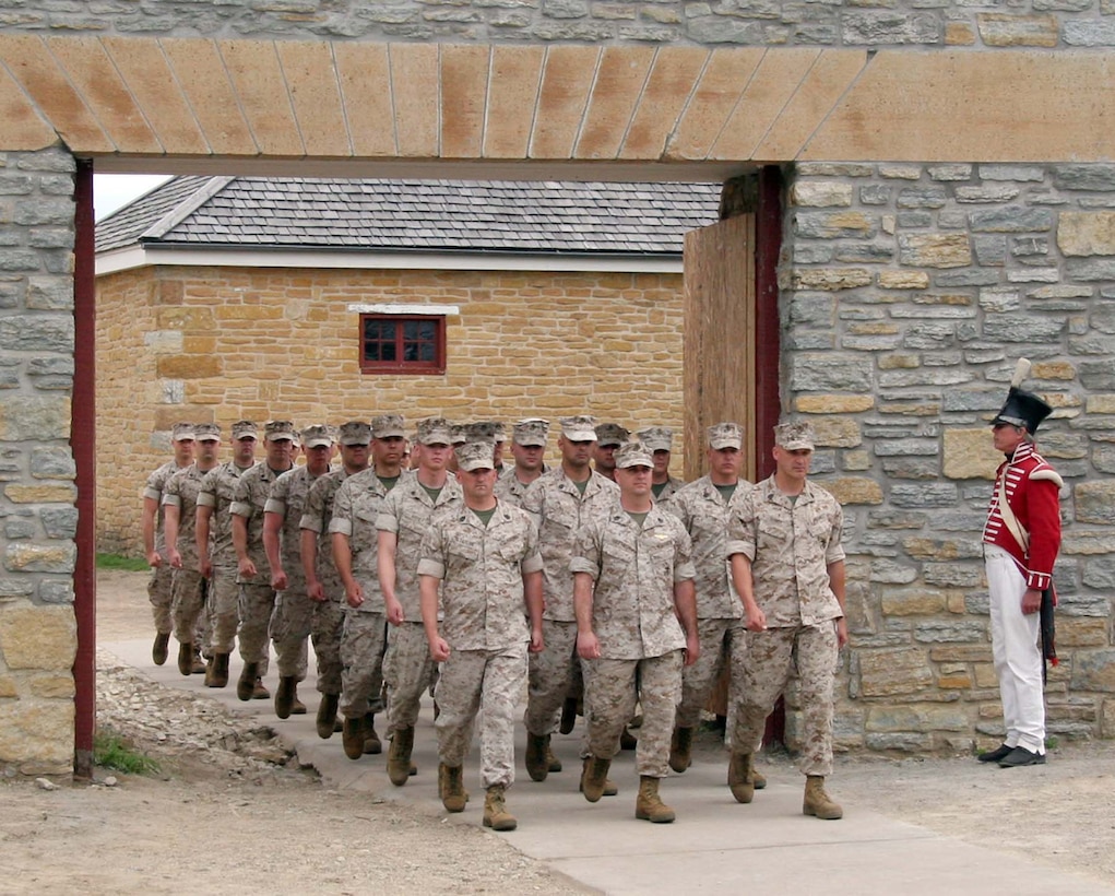 FORT SNELLING, MINN.—Marines march out the gates of Historic Fort Sneeling following the change of command ceremony for Recruiting Station Twin Cities. Maj. Kenneth C. Gawronski assumed command from Maj. Daniel E. Colvin during the ceremony here, June 25. Photo by Staff Sgt. Stephen L. Traynham