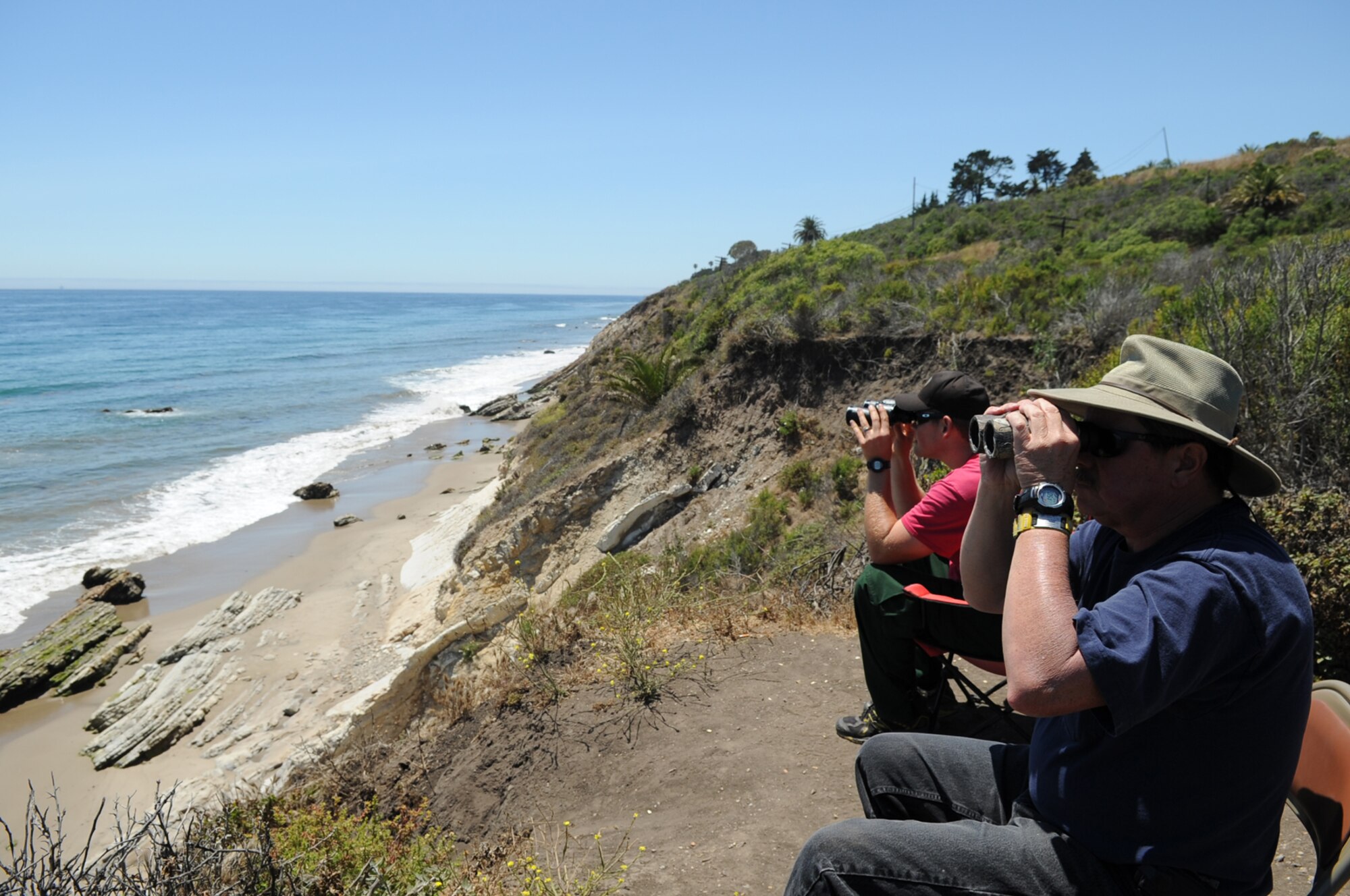 Santa Barbara, Calif. – Volunteers keep watch for missing Vandenberg firefighter, Sean Fleming, along the coastline here Friday, June 25, 2010. Mr. Fleming was last seen June 19 kayaking at Gaviota State Beach. (U.S. Air Force photo/Senior Airman Bryan Boyette)