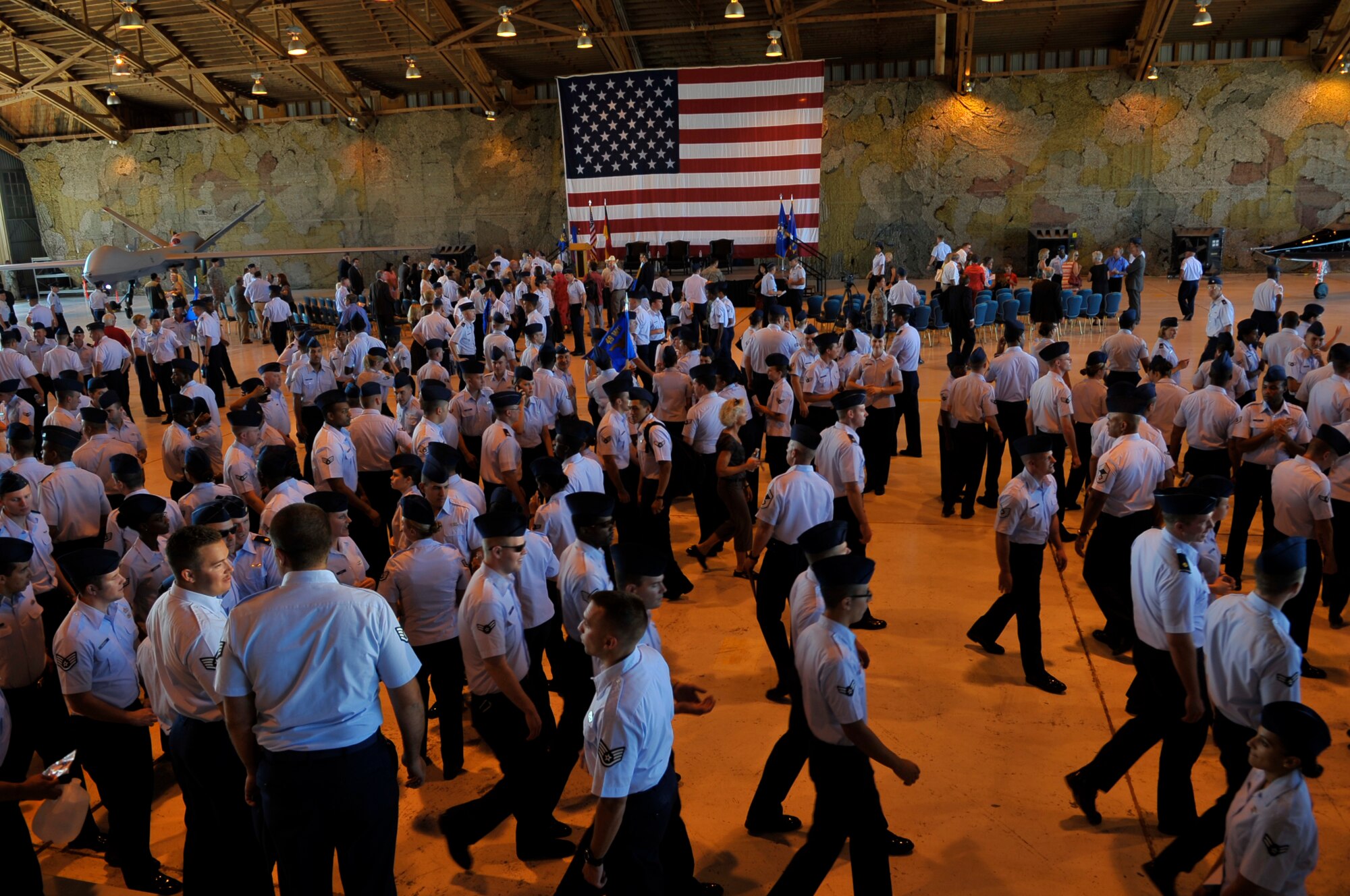 HOLLOMAN AIR FORCE BASE, N.M. -- Members of Team Holloman disperse after the 49th Wing Change of Command at hangar 301, June 25, 2010. The 49th Fighter Wing guidon was cased by Lt. Gen Glenn Spears and the 49th Wing guidon was presented to Col. David Krumm. (U.S. Air Force photo by Airman 1st Class Joshua Turner / Released)