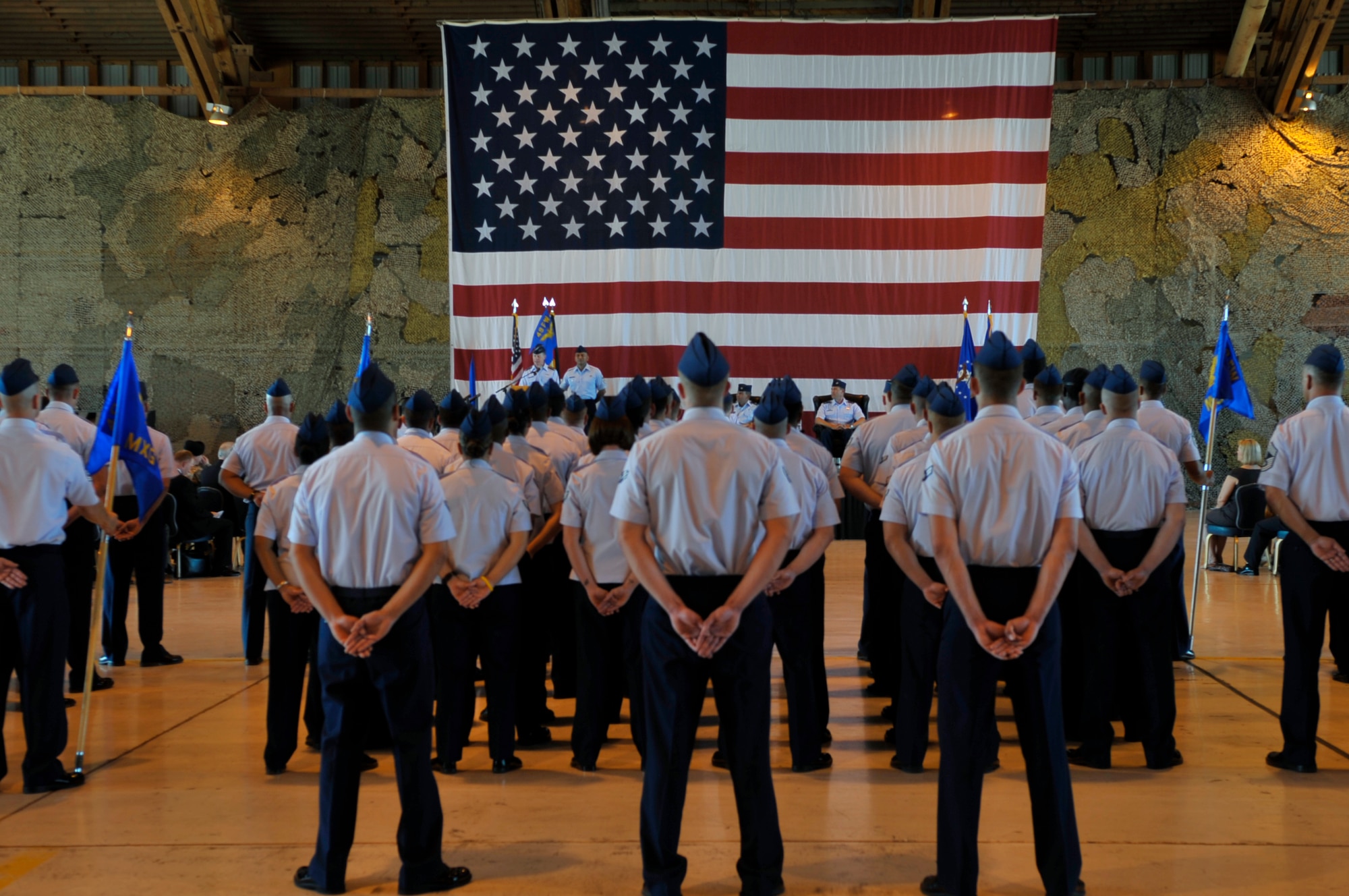 HOLLOMAN AIR FORCE BASE, N.M. -- Airmen of the 49th Wing listen to Lt. Gen. Glenn Spears, 12th Air Force commander, during the 49th WG Change of Command at hangar 301, June 25, 2010. The 49th Fighter Wing guidon was cased by Lt. Gen Glenn Spears and the 49th Wing guidon was presented to Col. David Krumm. (U.S. Air Force photo by Airman 1st Class Joshua Turner / Released)