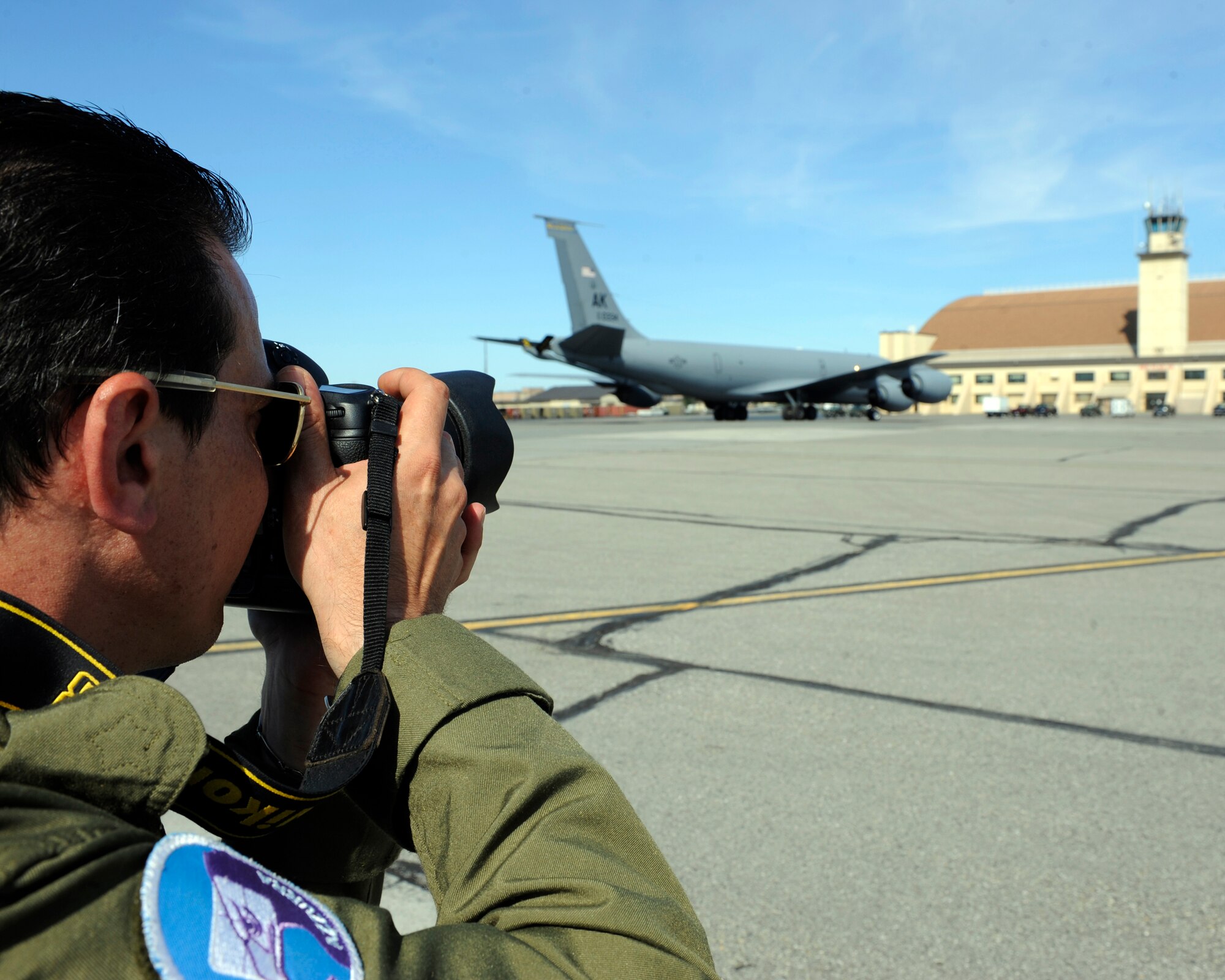 Italian Air Force Public Affairs photographs a KC-135 Stratotanker June 22, 2010, Eielson Air Force Base, Alaska. The ITAF PA team is documenting RED FLAG-Alaska while they are here. The KC-135 is assigned to the 168th Air Refueling Wing. (U.S. Air Force photo/Airman 1st Class Willard E. Grande II)