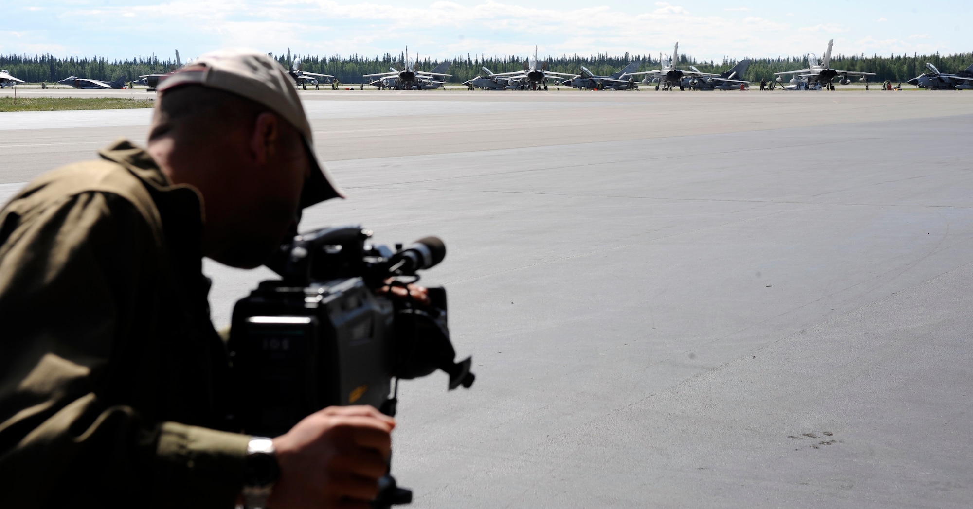 Italian Air Force Public Affairs videotapes Italian Panavia Tornados June 22, 2010, Eielson Air Force Base, Alaska. This video of static or continuous style of shooting is called b-roll. B-roll is used as visual filler during dialog in a presentation. (U.S. Air Force photo/Airman 1st Class Willard E. Grande II)