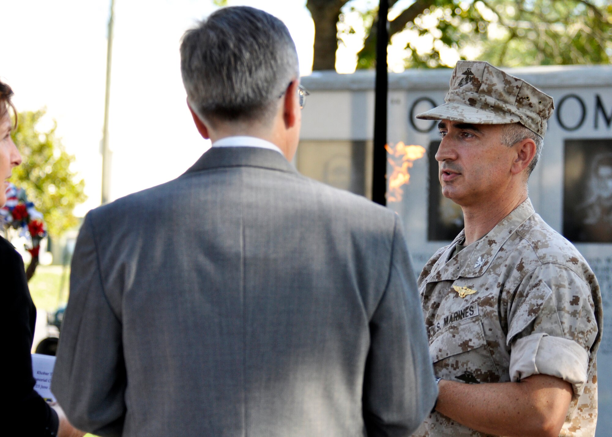 Colonel Arthur Tomassetti, 33rd Fighter Wing vice commander, speaks with Bridget Brooks, 36th Electronic Warfare Squadron (far left), prior to the ceremony marking the 14th anniversary of the Khobar Towers tragedy at the memorial on Eglin Air Force Base, Fla., June 25. Mrs. Brooks lost her son, Airman 1st Class Joseph Rimkus, in the attack. Almost 100 friends, family and current members of the 33rd Fighter Wing gathered for a remembrance ceremony here near the memorial dedicated to the heroism of 12 Airmen lost. The 33rd FW suffered 105 wounded personnel and accounted for 12 of the 19 Airmen killed in the Khobar Towers terrorist attack June 25, 1996. (U.S. Air Force Photo/ Samuel King Jr.)    