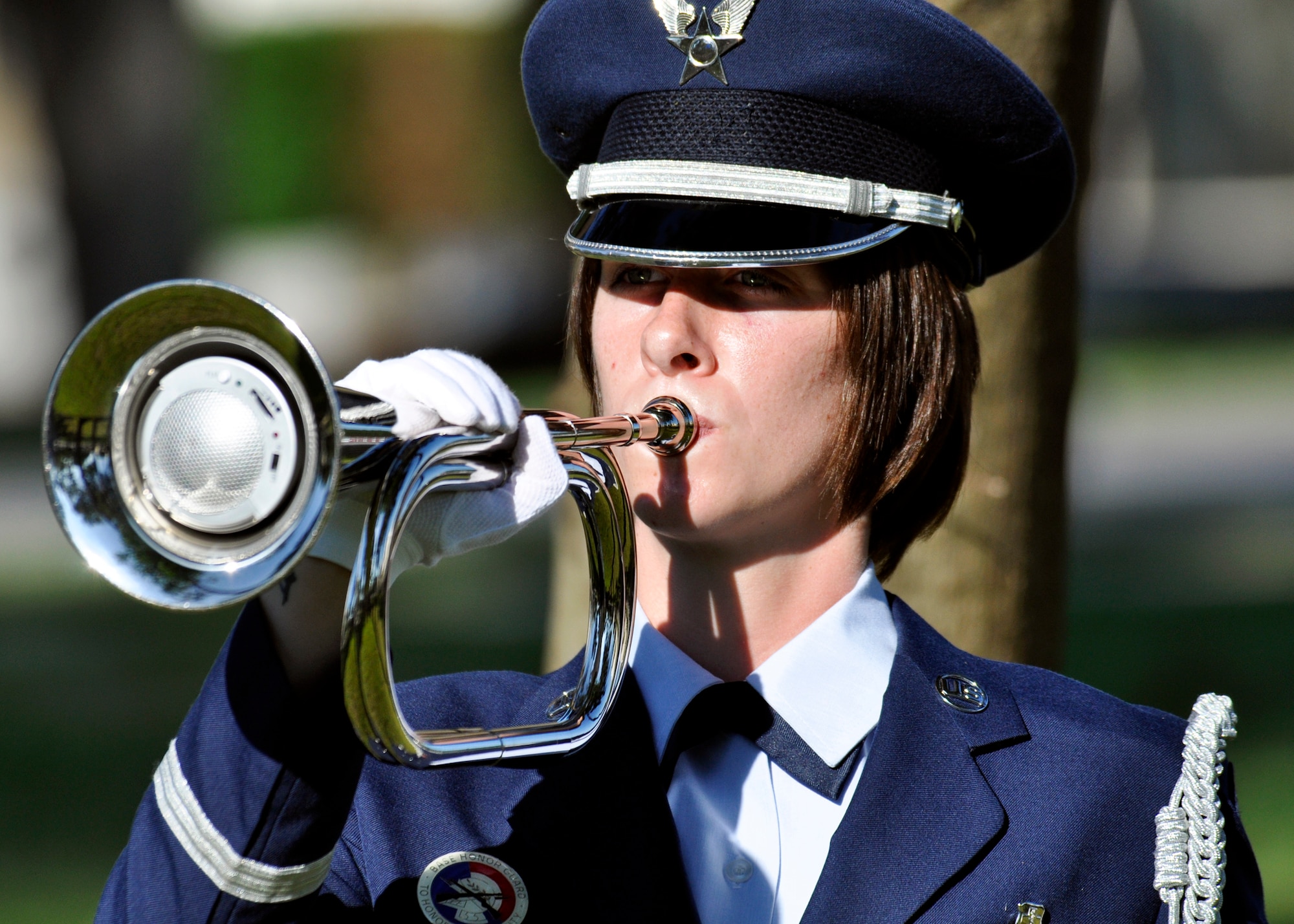 Senior Airman Londan Bishop, 96th Air Base Wing honor guard, performs “Taps” during a ceremony remembering the victims of the Khobar Towers bombing at the memorial on Eglin Air Force Base, Fla., June 25.  Almost 100 friends, family and current members of the 33rd Fighter Wing gathered, on the 14th anniversary of the tragedy, near the memorial dedicated to the heroism of 12 Airmen lost. The 33rd FW suffered 105 wounded personnel and accounted for 12 of the 19 Airmen killed in the Khobar Towers terrorist attack June 25, 1996. (U.S. Air Force Photo/ Samuel King Jr.)