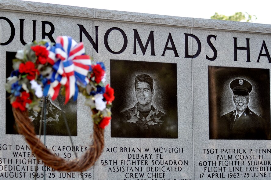 A wreath was placed in front of the Khobar Towers Memorial on the 14th anniversary of the tragedy during a ceremony June 25 at Eglin Air Force Base, Fla. Almost 100 friends, family and current members of the 33rd Fighter Wing gathered for a remembrance ceremony near the memorial dedicated to the heroism of 12 Airmen lost. The 33 FW suffered 105 wounded personnel and accounted for 12 of the 19 Airmen killed in the Khobar Towers terrorist attack June 25, 1996. (U.S. Air Force photo/Samuel King Jr.) 