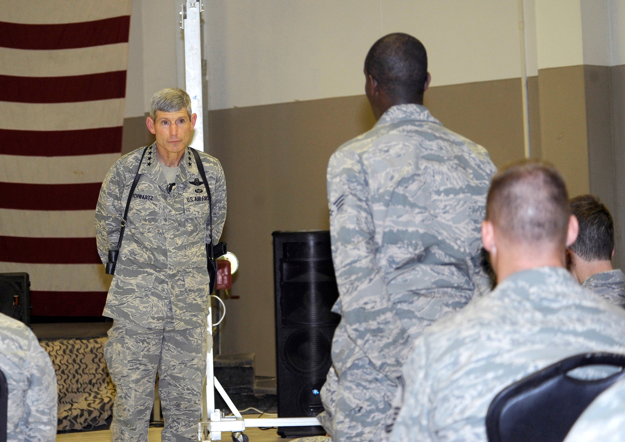 Gen. Norton Schwartz listens to a question from Senior Airman Christopher Powell during a visit June 24, 2010, at Joint Base Balad, Iraq. During the meeting, General Schwartz discussed Air Force priorities and answered questions from members of the 332nd Air Expeditionary Wing. General Schwartz is the Chief of Staff of the Air Force. Airmen Powell is an executive administrator with the 732nd Air Expeditionary Group. (U.S. Air Force photo/Senior Airman Matt Coleman-Foster)