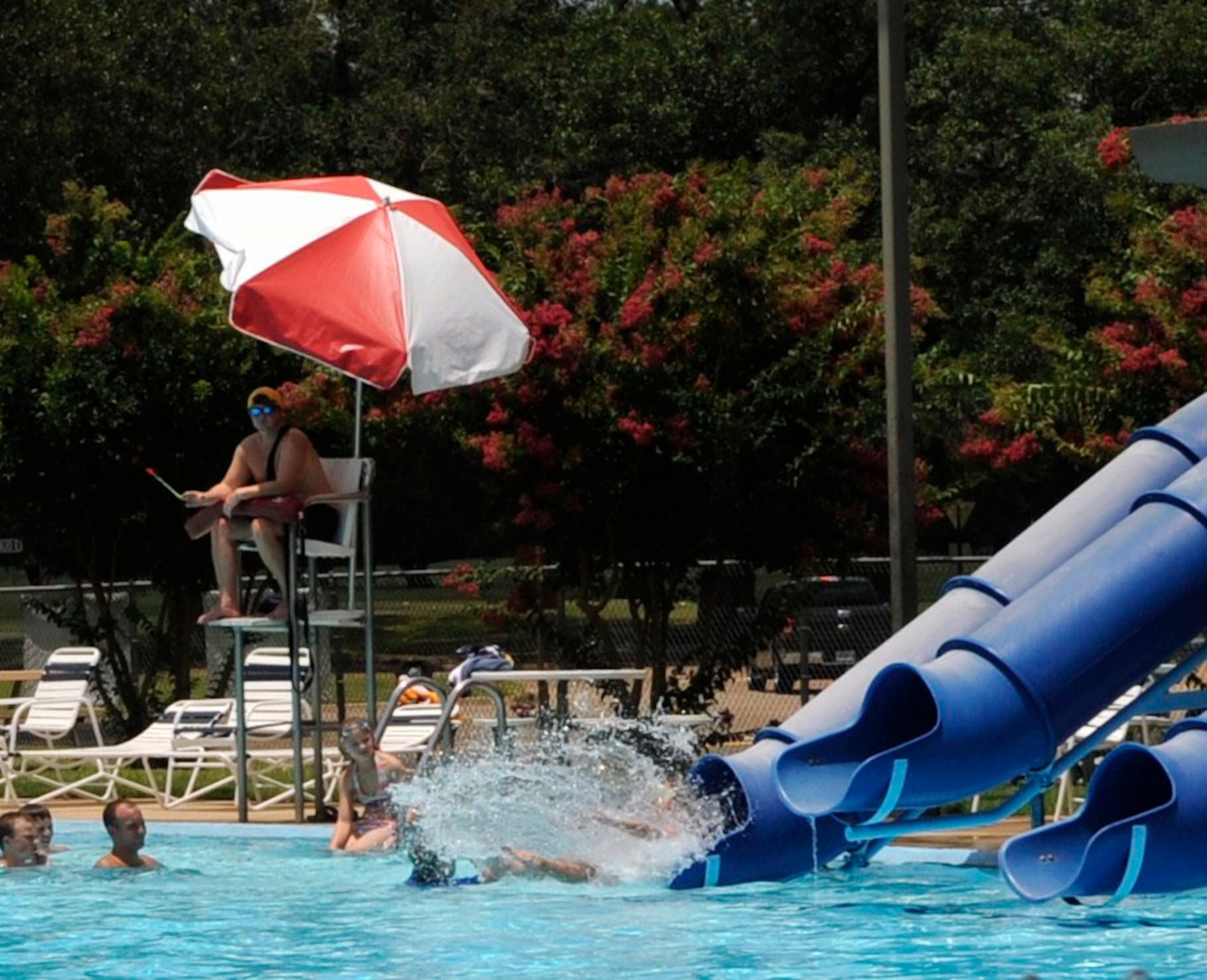 BARKSDALE AIR FORCE BASE, La.-- Jacob Navarro, a Barksdale lifeguard, watches over swimmers at Barksdale's West Pool. Mr. Navarro, along with his fellow lifeguard, Kasey Schluter, saved the life of a young boy who almost drowned May 28. (U.S. Air Force photo by Senior Airman Megan M. Tracy) (RELEASED)