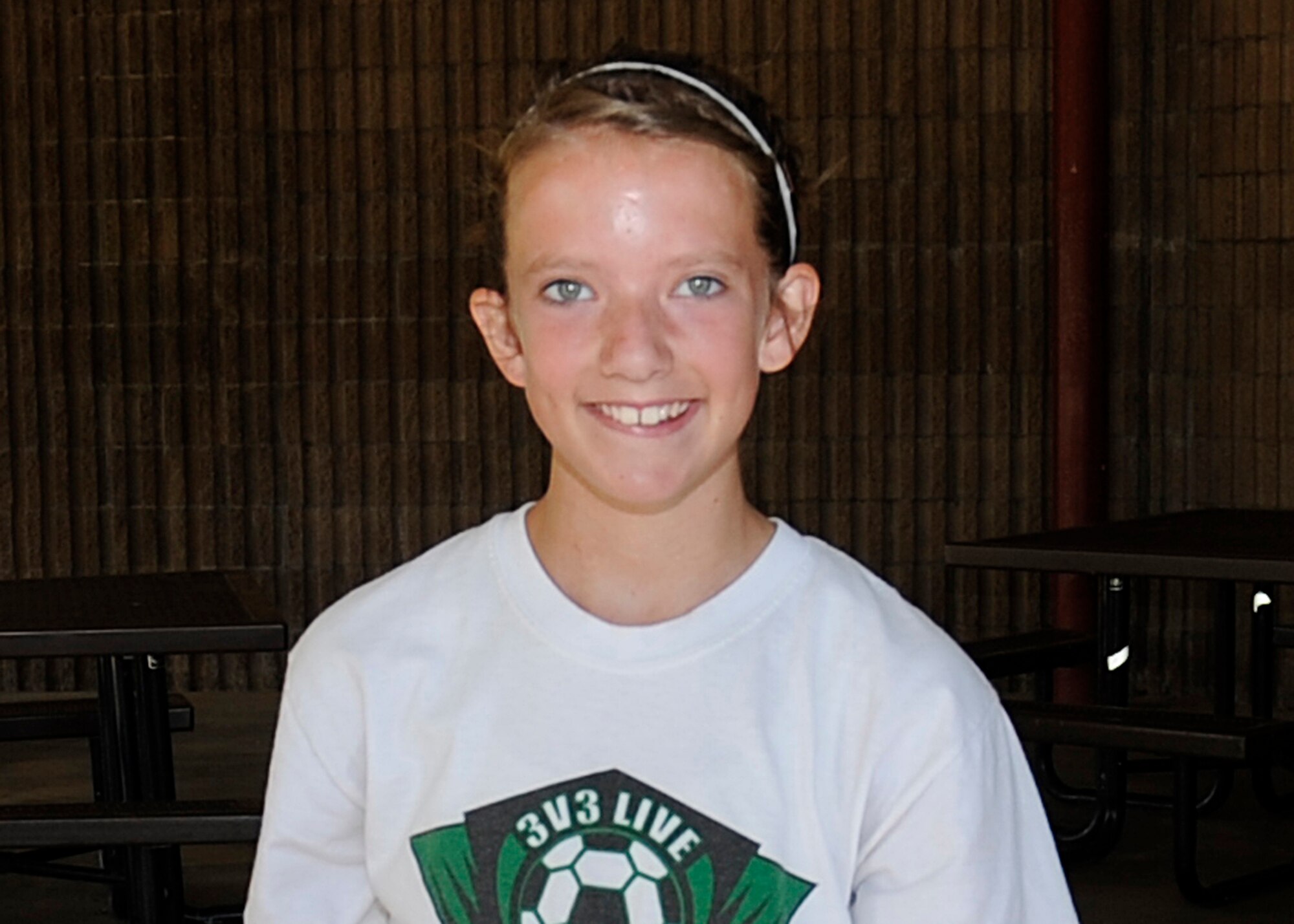 Claire Caffrey, daughter of Tech Sgt. Edward Caffrey, 27th Special Operations Aerospace Medicine Squadron, placed first on the 2010 Summer Solstice 5K Run Jun 25. Claire finished with a time of 27:42. (U.S. Air Force Photo by Senior Airman Evelyn Chavez)