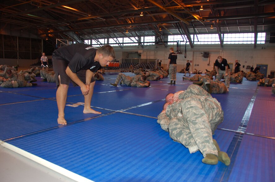 Cadet Joseph Correia, a combatives instructor from Kansas State University, ensures the utilization of proper technique during combative training. Combative training is part of the summer Air Force Reserve Officer Training Corps’ 28-day field training program at Maxwell. (U.S. Air Force photo/Airman 1st Class Christopher S. Stoltz)