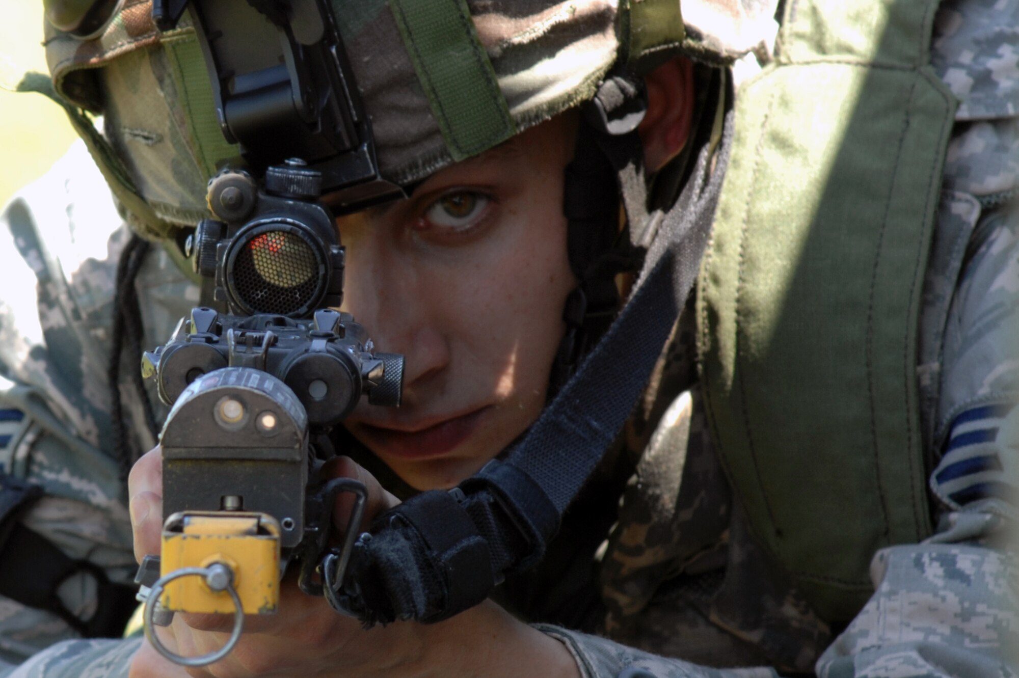 WHITEMAN AIR FORCE BASE, Mo. - Staff Sgt. John Meagher, 509th Security Forces Squadron, views a simulated attack through the reticle on an M-4 carbine during an exercise June 18, 2010. Sergeant Meagher took a defensive position to provide support fire during the start of the exercise. (U.S. Air Force photo by Tech. Sgt. Charles D. Larkin Sr.)