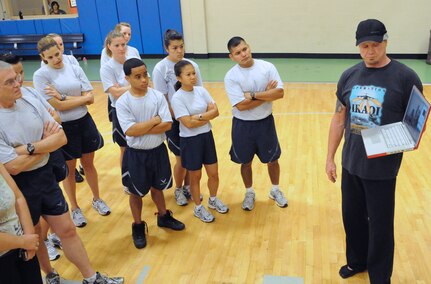 WWF Heavyweight Champion Dallas Page  shows a video to Randolph personnel introducing his YRG Fitness System June 25 at the Rambler Fitness Center.  (U.S. Air Force photo by Don Lindsey)