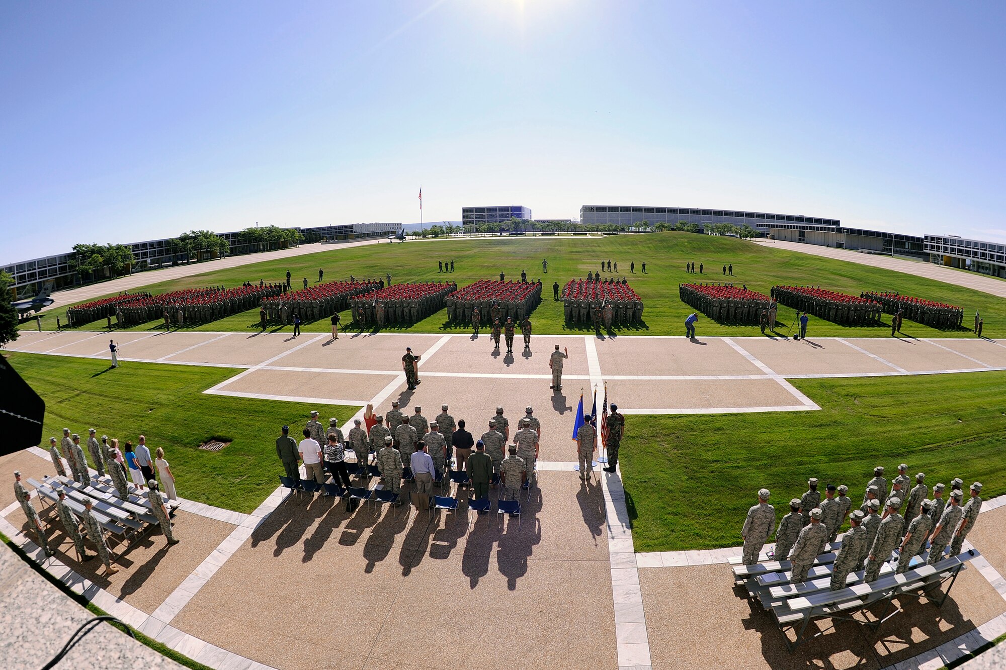 Brig. Gen. Sam Cox, center, administers basic cadets' oaths of allegiance during a swearing-in ceremony at the Air Force Academy in Colorado Springs, Colo., June 25, 2010. General Cox is the Academy commandant of cadets, responsible for more than 4,000 cadets' military training and airmanship education, supervising cadet life activities and supporting facilities and logistics. (U.S. Air Force photo/Mike Kaplan)