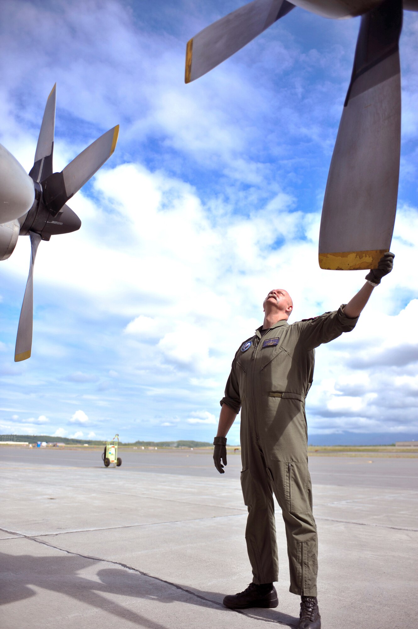 Belgian Air Component Adjudant Christlaen Yues performs a pre-flight inspection on a Belgian C-130 Hercules June 22, 2010, at Joint Base Elmendorf-Richardson, Alaska. This was the first time the BAC has participated in Red Flag-Alaska. Adjudant Yues is a BAC 15th Air Transport Wing 20th Squadron flight engineer. (U.S. Air Force photo/Airman 1st Class Christopher Gross)