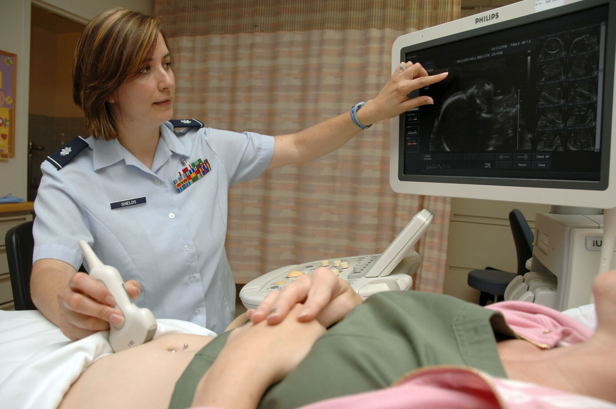 Lt. Col. (Dr.) Andrea Shields performs an ultrasound on a patient June 21, 2010 in the Wilford Hall Medical Center at Lackland Air Force Base, San Antonio, while explaining the benefits of her pre-term birth study. Doctor Shields is a maternal-fetal medicine specialist. (U.S. Air Force photo/Senior Airman Josie Walck)