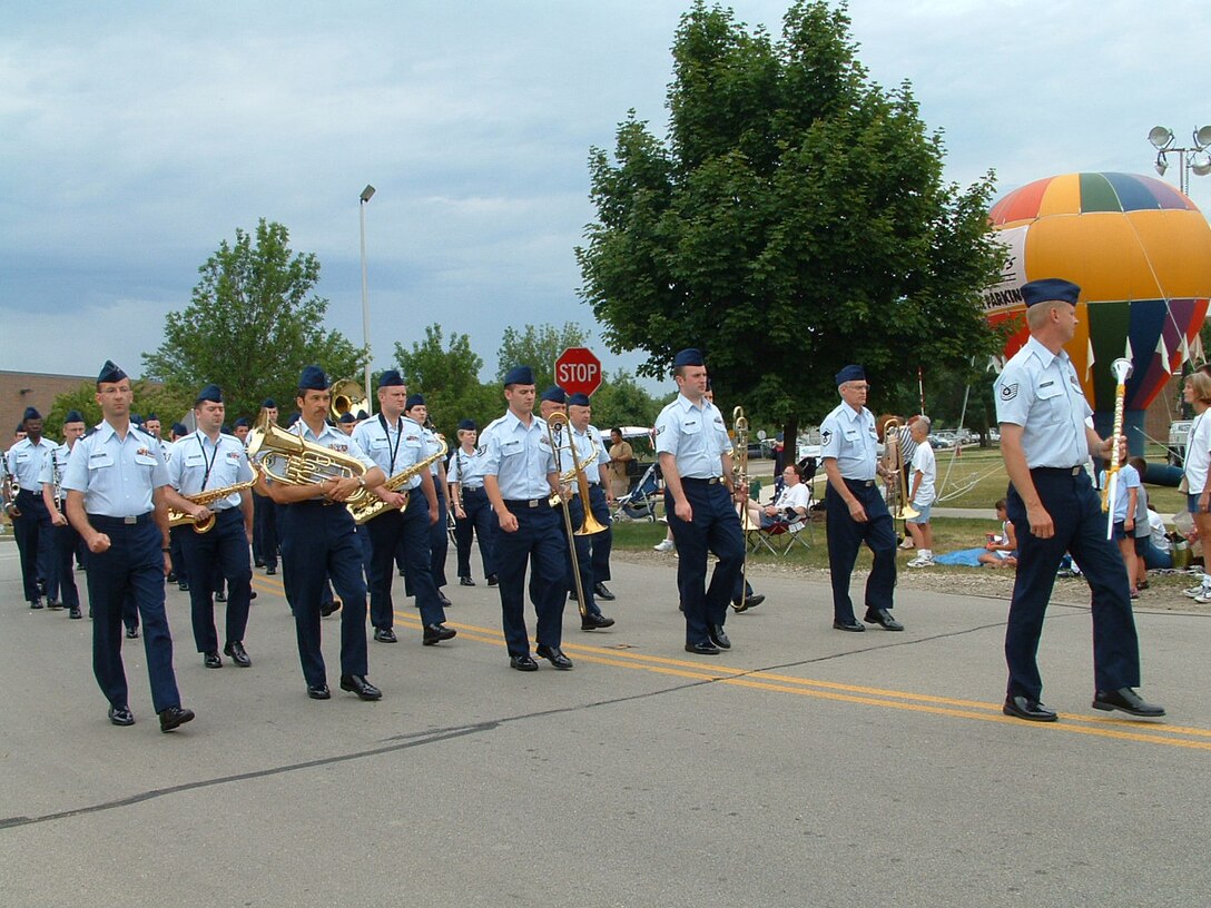 The Air National Guard Band of the Midwest marching in the Lisle 4th of July Parade.  The Concert Band, and Harmony in Blue, performed later that evening for the fireworks display.  This photo was taken by a civilian bystander in 2004.