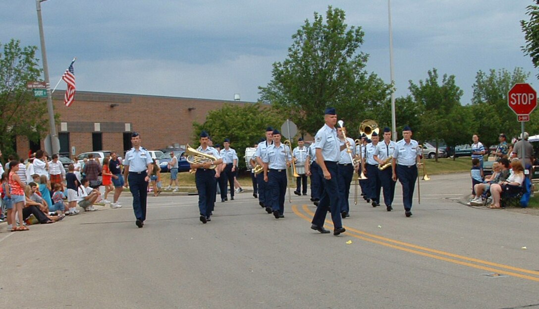 The Air National Guard Band of the Midwest marching in the Lisle 4th of July Parade.  The Concert Band, and Harmony in Blue, performed later that evening for the fireworks display.  This photo was taken by a civilian bystander in 2004.