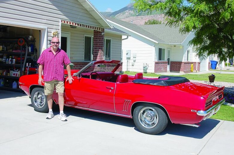 Dalton stands next to the Camaro he plans on entering in the 309th Maintenance Wing Car Show on June 30. (U.S. Air Force photo by: Bill Orndorff)