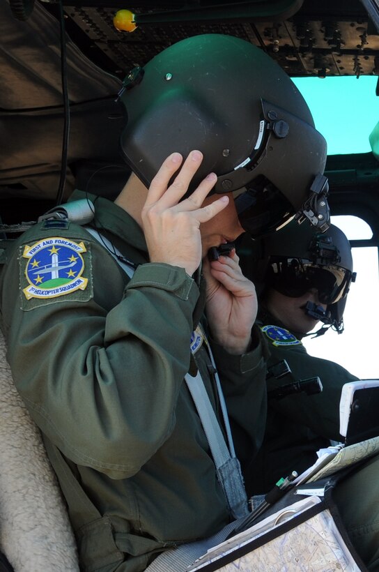 Captains Christopher Karins and Jamey Rankin, 1st Helicopter Squadron pilots, prepare for takeoff at Joint Base Andrews, Md. June 24, 2010. This is Karins’ final flight as a member of the 1 HS, after completing his tour as executive officer for the 316th Wing commander.  The 1 HS is responsible for alert contingency response for the National Capital Region.  (U.S. Air Force photo by Senior Airman Melissa V. Brownstein) 
