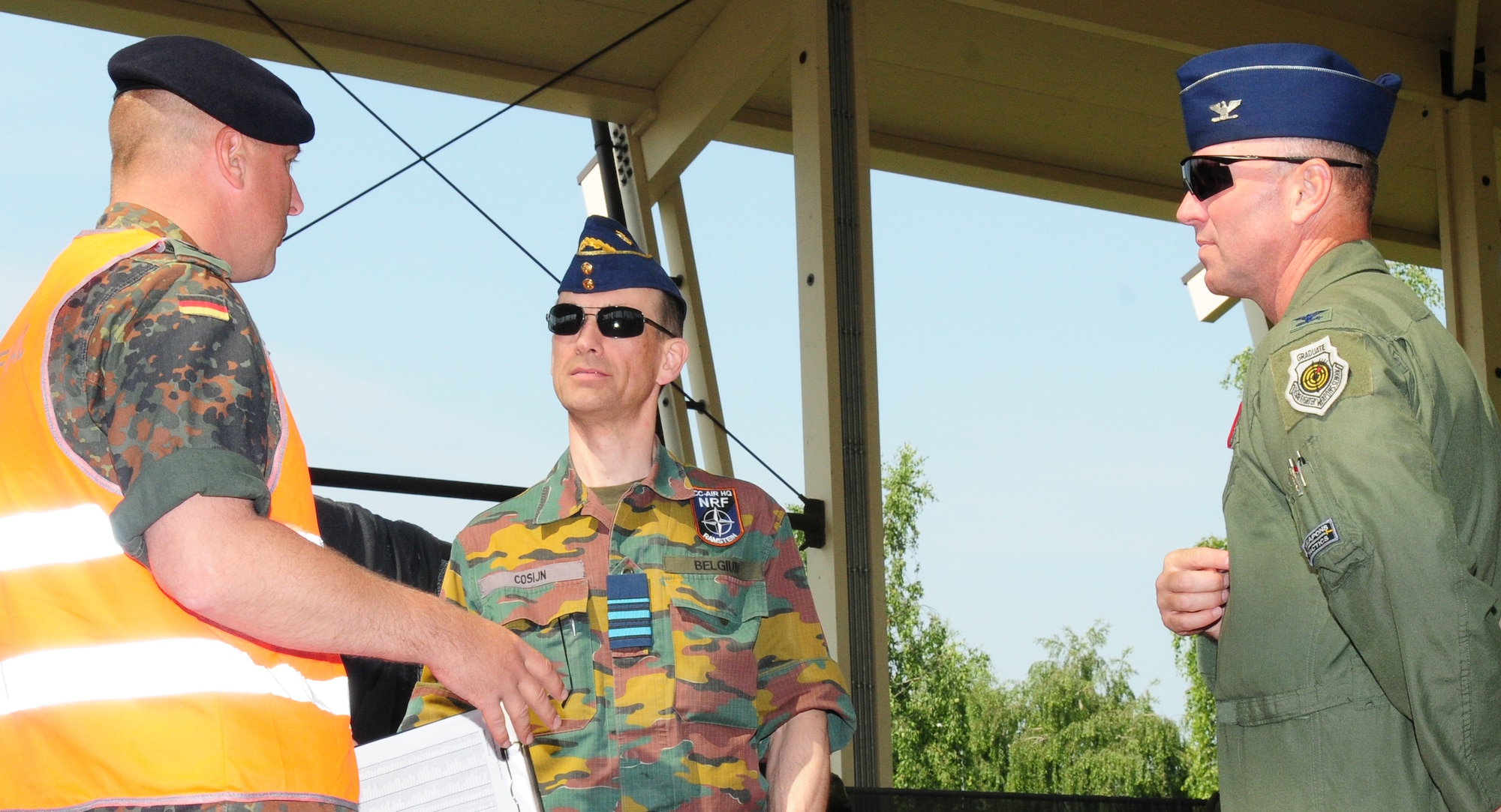 SPANGDAHLEM AIR BASE, Germany – A NATO inspector, left, explains the individual core competency skills assessment to Brig. Gen. Wily Cosijn, center, Belgium air force deputy chief of staff, and Col. Tip Wight, 52nd Fighter Wing commander, here June 25. The ICCS assessments are one portion of the NATO force evaluation Spangdahlem has participated in this week. These skills are critical assets military members need to proficiently conduct contingency operations that may require crisis intervention, such as deployments or NATO missions. Representatives of the NATO countries want to gain insight to aid in upcoming inspections and daily processes. (U.S. Air Force photo/Staff Sgt. Heather M. Norris)