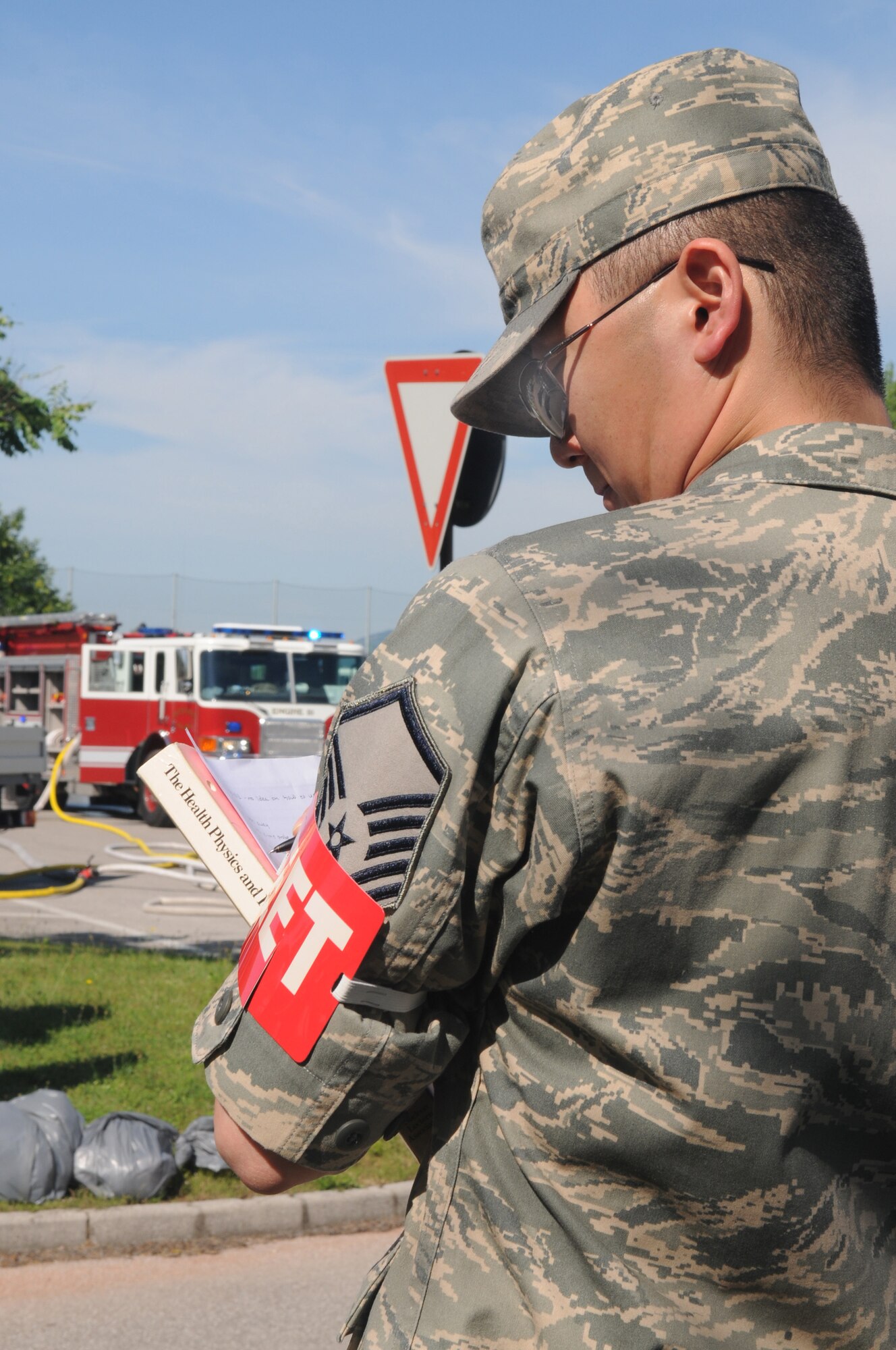 Master Sgt. Rick Chang, 31st Aerospace Medicine Squadron exercise evaluation team member, conducts an evaluation on first responders assessing the detection and identification of radioactive materials at the scene of a major accident response exercise April 23. (U.S. Air Force photo/Staff Sgt. Nadine Y. Barclay) 