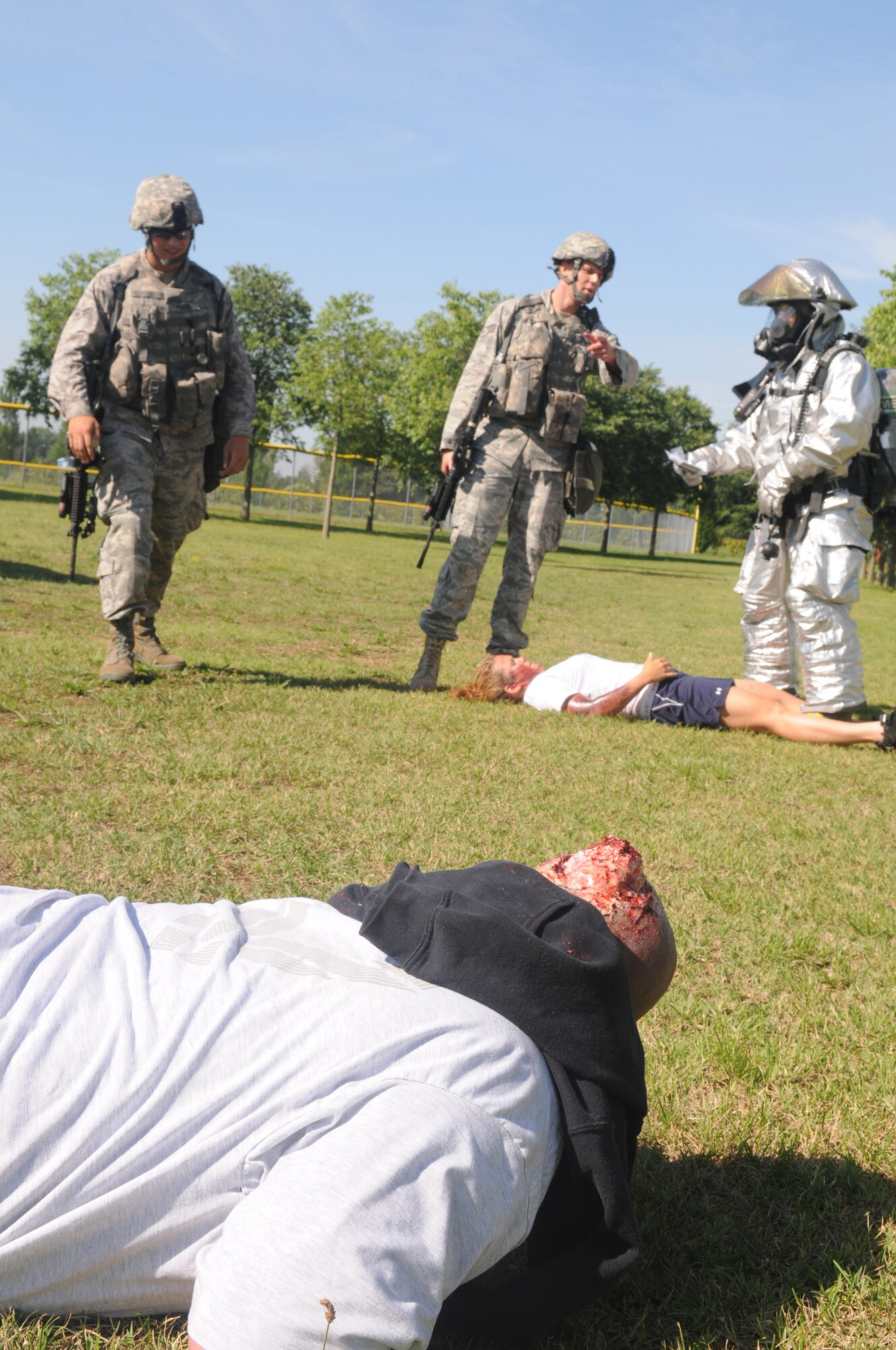 Firefighters assigned to the 31st Civil Engineer Squadron and security response team member from the 31st Security Forces Squadron evaluate the scene while responding to a major accident response exercise April 23. First responders were evaluated on their performance, such as assessing the scene for hazardous material, providing self aid and buddy care to victims, and protecting the scene from continued threats. (U.S. Air Force photo/Staff Sgt. Nadine Y. Barclay) 