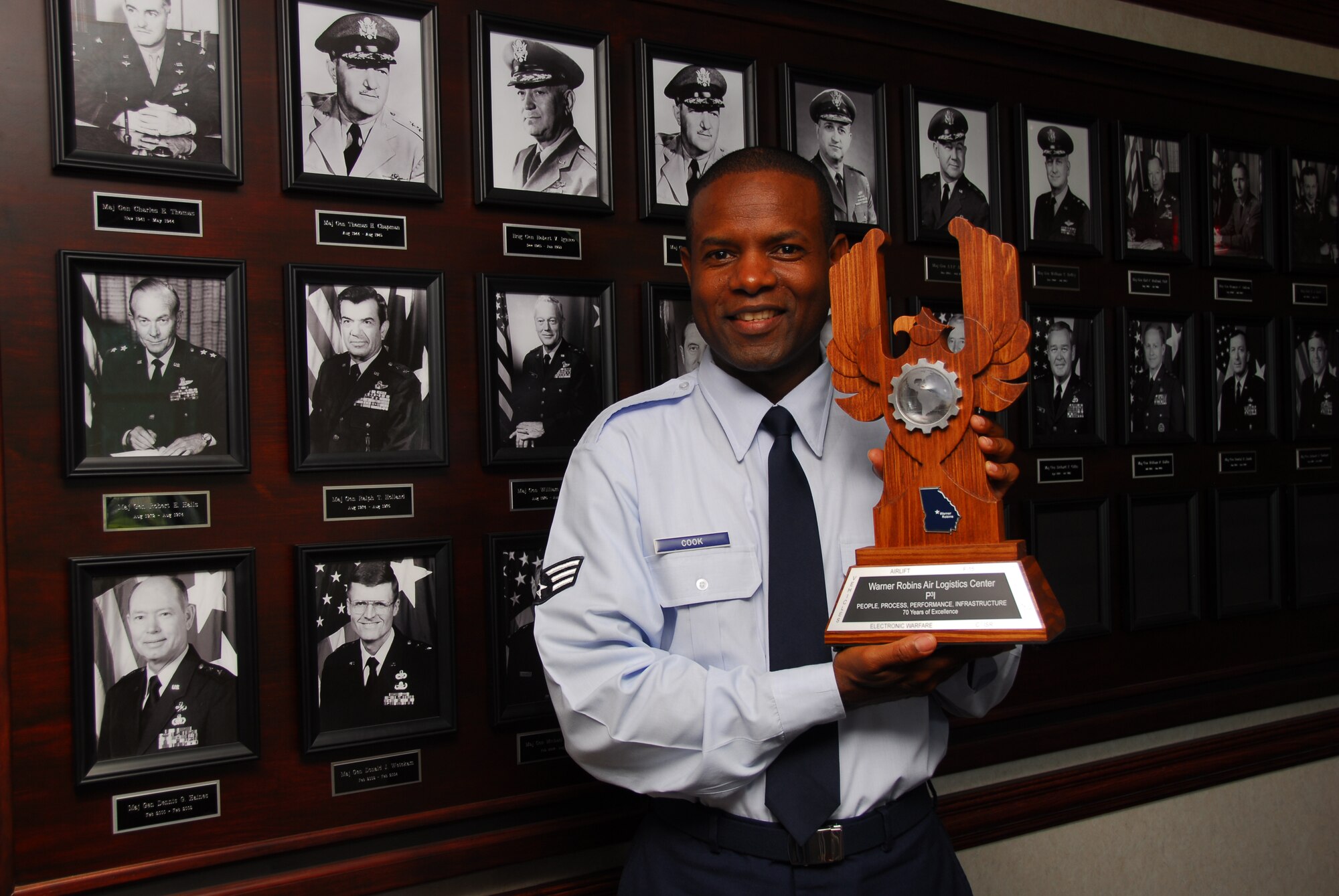 The new heraldic device was designed by Senior Airman Columbus Cook, 116th Civil Engineer Squadron.  U.S. Air Force photo by Ed Aspera