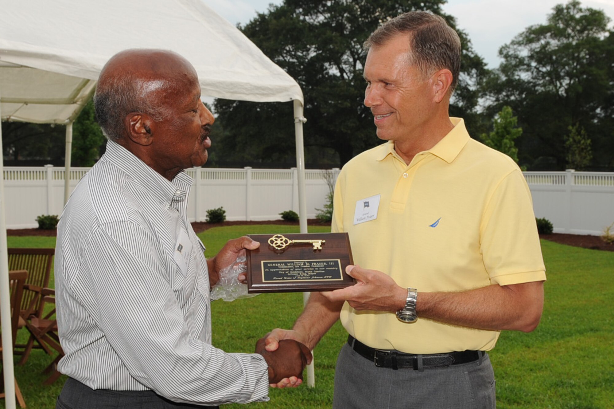 SEYMOUR JOHNSON AIR FORCE BASE, N.C. – Goldsboro Mayor Al King presents commander, Air Combat Command, Gen. William Fraser III a golden key to the city June 16, 2010. During his visit, General Fraser received a tour of the base, listened to the base’s challenges and spoke to Airmen about hot topics affecting them. General Fraser is also the Air Component Commander for U.S. Joint Forces Command. (U.S. Air Force photo/Staff Sgt. Courtney Richardson)