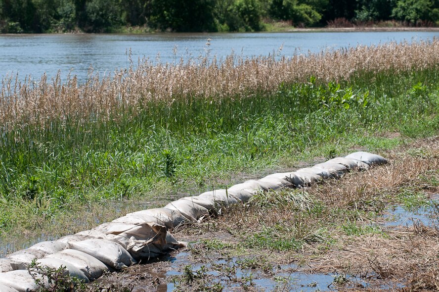 A single row of sand bags  stand vigil on a  levy as flood water from the swelling Missouri river threatens the communities surrounding Bean Lake Missouri, June 24, 2010. After weeks of heavy rains, Governor Jay Nixon declares a state of emergency on June 21, with the 139th Airlift Wing in St. Joseph Mo., taking command in North West Missouri for the National Guard.  (U.S. Air Force photo by Master Sgt. Shannon Bond/Released)