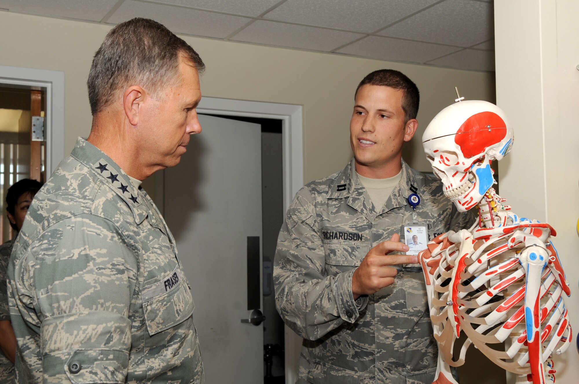 SEYMOUR JOHNSON AIR FORCE BASE, N.C. – Capt. Jordan Richardson explains a common rotator cuff injury and the different methods to treat it to Gen. William M. Fraser III here, June 17, 2010. Physical therapists help injured Airmen recover and get back to their full potential. Captain Richardson is a physical therapist from Humboldt, Tenn. (U.S. Air Force photo/Staff Sgt. Courtney Richardson)