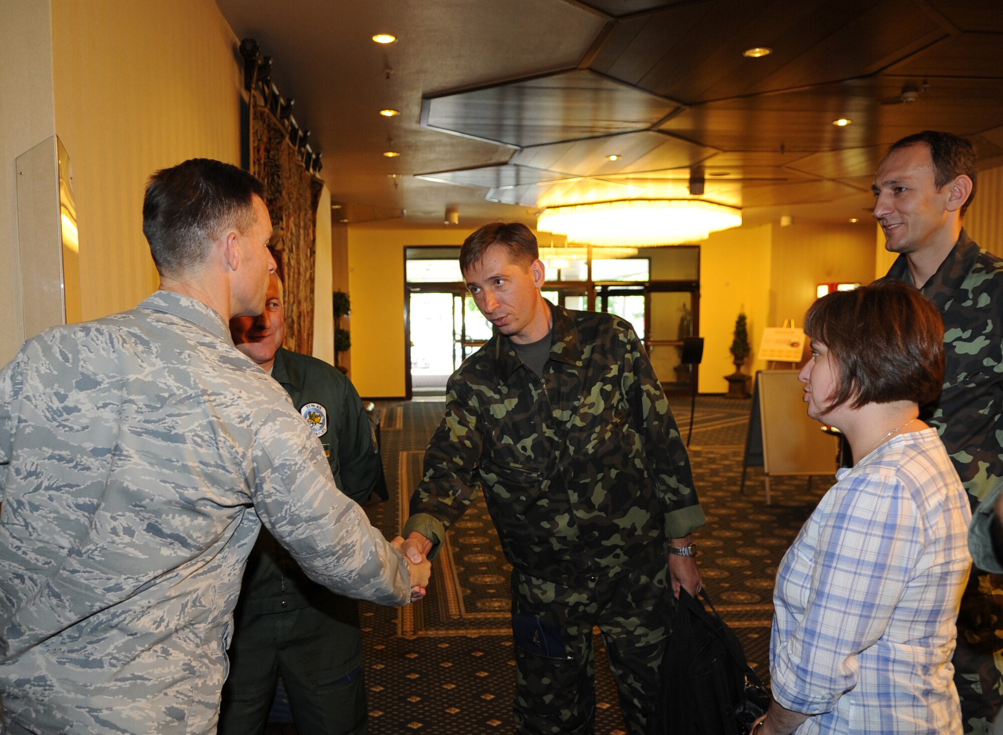 U.S. Air Force Brig. Gen. Mark Dillon, 86th Airlift Wing commander, greets and shakes hands with Ukrainian Air Force members during a visit to Ramstein Air Base, Germany, June 25, 2010. The goal of the Ukrainian visit was to help advance military interoperability and build international partnerships. (U.S. Air Force photo by Senior Airman Caleb Pierce)