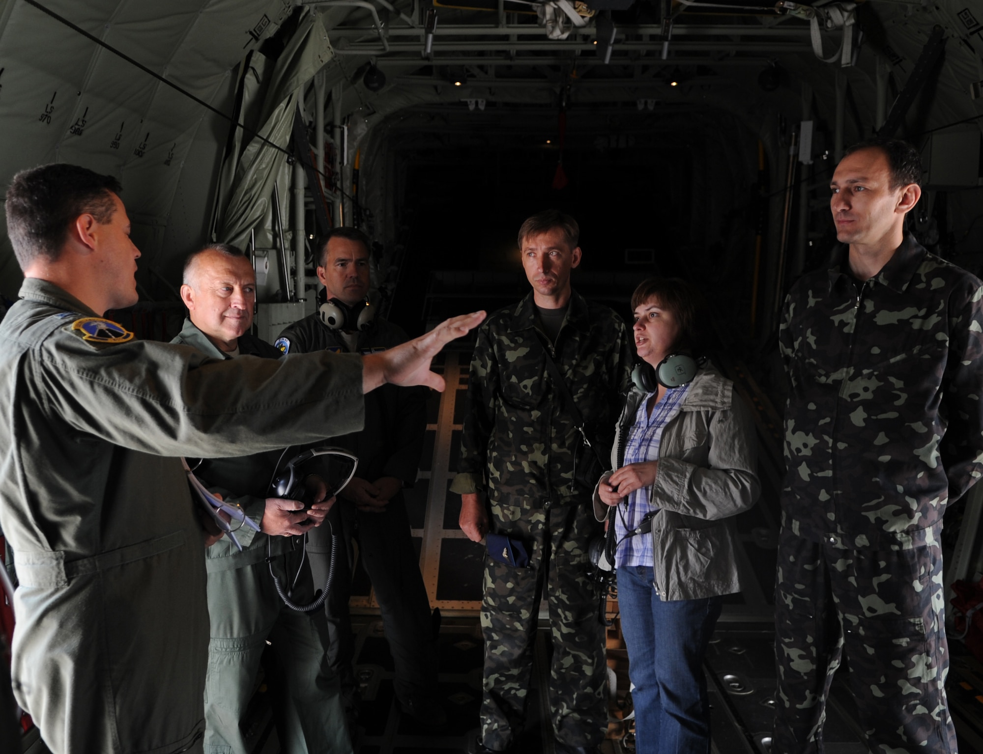 U.S. Air Force Capt. Jeremy Wagner, 86th Operations Support Squadron C-130J pilot, gives a pre-flight brief prior to a castle tour with Ukrainian Air Force members and official interpreter during a visit to Ramstein Air Base, Germany, June 25, 2010. The goal of the Ukrainian visit was to help advance military interoperability and build international partnerships. (U.S. Air Force photo by Senior Airman Caleb Pierce)