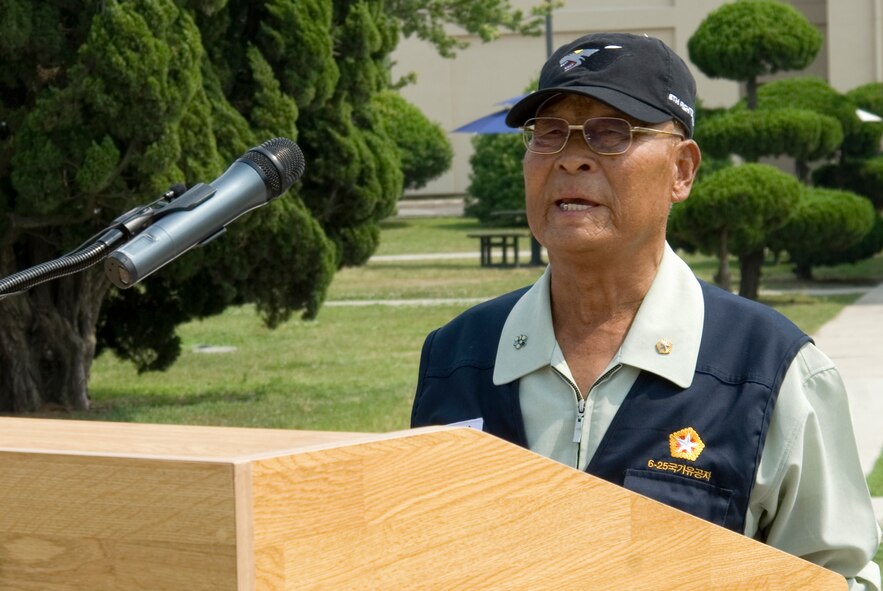 KUNSAN AIR BASE, Republic of Korea -- Sang Don Sin, Korean War Veterans Association Gunsan Chapter Vice Chairman, speaks about his experiences during the Korean War during the 60th anniversary of the Korean War commemoration ceremony held at the base flag pole.  In total, 51 Korean War veterans including Vice Chairman Sin attended the ceremony, as well as Col. Jae Hun Choi, 38th Fighter Group Commander. (U.S. Air Force photo/Staff Sgt. Jonathan Pomeroy)