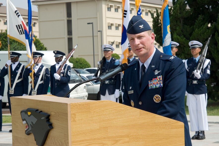 KUNSAN AIR BASE, Republic of Korea -- Col. John Dolan, 8th Fighter Wing commander, gives his opening remarks during the 60th anniversary of the Korean War commemoration ceremony held at the base flag pole.  In total, 51 Korean War veterans attended the ceremony, which also included a three volley salute by seven 8th Security Forces Squadron members. (U.S. Air Force photo/Staff Sgt. Jonathan Pomeroy)