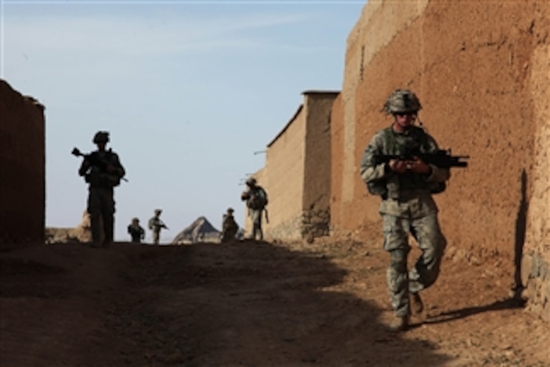U.S. Army soldiers from 1st Platoon, Bulldog Troop, 1st Squadron, 91st Cavalry Regiment make their way into Paspajak in Logar province, Afghanistan, during a patrol to check on conditions in the village on June 20, 2010.  