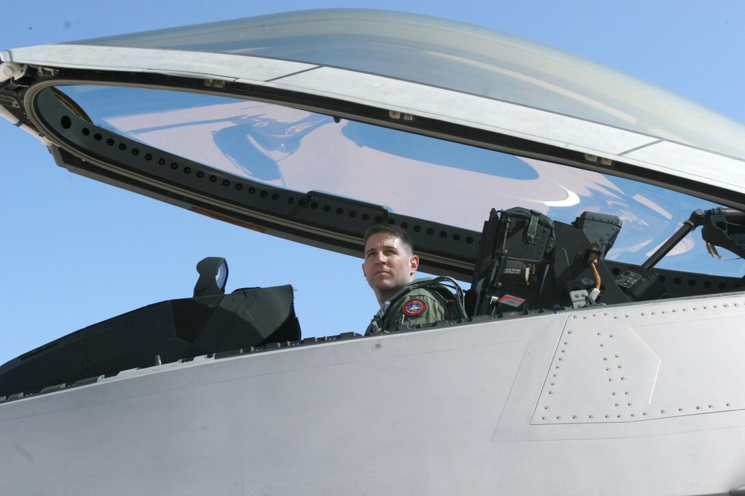 After climbing into the cockpit of an F-22 "Raptor" to perform a system's check, Lt. Col. David R. Berke, the Marine Corps F-22 exchange pilot, 422nd Test and Evaluation Squadron, Nellis Air Force Base, Nev., glances over to his air traffic controller for further instructions June 25. For approximately four weeks, Berke participated in exercise Trident Warrior held at Marine Corps Air Station Miramar.