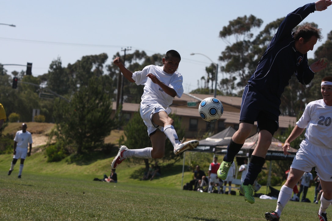 Miriani Aguilarsoto, a player for the Combat Center's base soccer team, ninja kicks the ball during a tournament game against the Scottish Highlanders June 27 at Marine Corps Base Camp Pendleton.