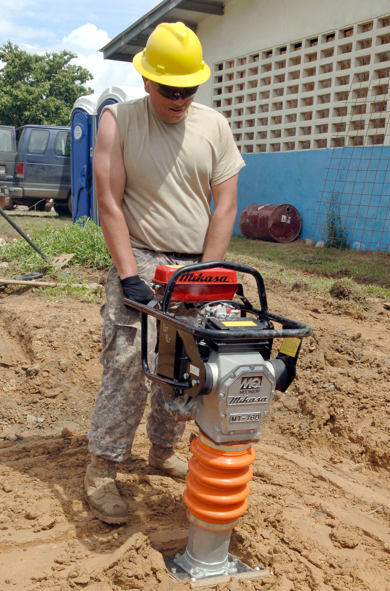 Pvt. Bryan Cornejo, construction engineer with the 372nd Engineer Company, compacts the ground beneath the future site of a new water tower June 26 at Santa Librada elementary school in Panama. The Army Reservists are deployed in support of New Horizons Panama 2010, a humanitarian assistance mission designed to strengthen partnerships between the United States and Panama. (U.S. Air Force photo/Tech. Sgt. Eric Petosky)