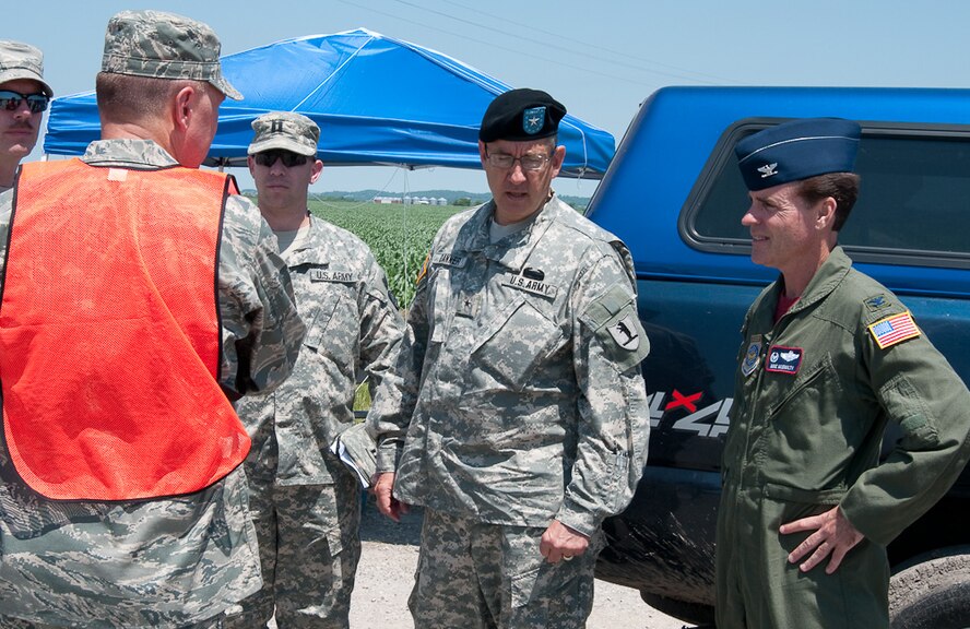 Brigadier General Stephen Danner, Missouri adjutant general, and Col Mike McEnulty, 139th Airlift Wing commander visits with Air and Army National Guardsmen who are manning check points at closed roads, June 25, 2010. After weeks of heavy rains, Governor Jay Nixon declares a state of emergency on June 21, with the 139th Airlift Wing in St. Joseph Mo., taking command in Northwest Missouri for the National Guard's Joint Task Force.  (U.S. Air Force photo by Master Sgt. Shannon Bond/Released)