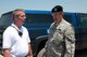 Brigadier General Stephen Danner, Mo. adjutant general, speaks to the Holt county sheriff Scott Wedlock on a flooded road in Holt county Mo., June 25, 2010. After weeks of heavy rains, Governor Jay Nixon declares a state of emergency on June 21, with the 139th Airlift Wing in St. Joseph Mo., taking command in Northwest Missouri for the National Guard's Joint Task Force.  (U.S. Air Force photo by Master Sgt. Shannon Bond/Released)