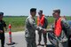 Brigadier General Stephen Danner, Mo. adjutant general, shakes  Army National Guard Specialist Joshua Hughes, hand and thanks him for his hard work - Hughs is from St. Joseph Mo., along with Airman 1st Class, Ryan Schuepbach, Mo. Air National Guard, as they jointly monitor a check point on a flooded road in Holt county Mo., June 25, 2010. After weeks of heavy rains, Governor Jay Nixon declared a state of emergency on June 21, with the 139th Airlift Wing in St. Joseph Mo., taking command in Northwest Missouri for the National Guard's Joint Task Force.  (U.S. Air Force photo by Master Sgt. Shannon Bond/Released)