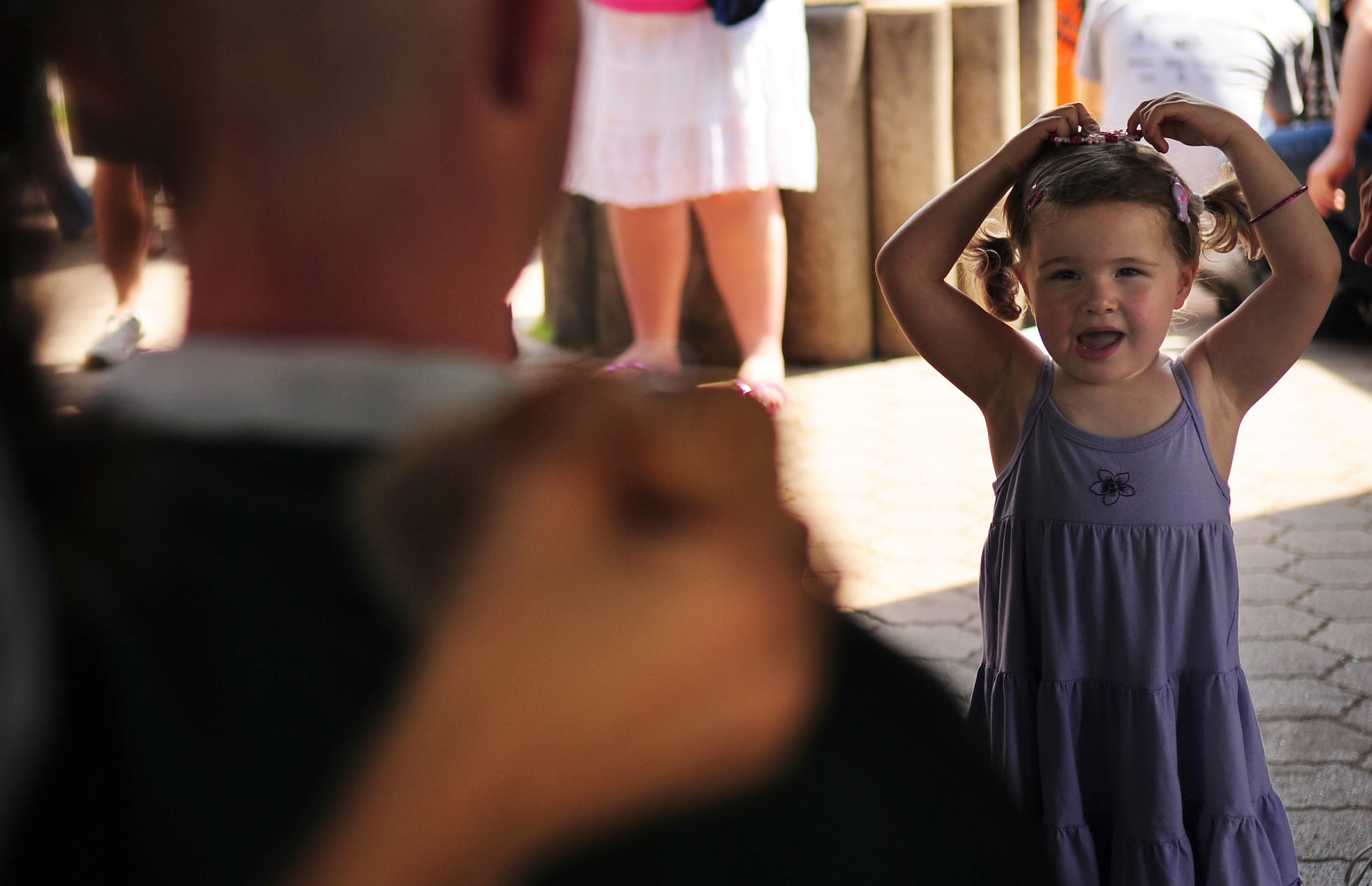 Josephine "Josie" Beardsley, 3, reacts to her father, U.S. Air Force Tech. Sgt. Timothy Beardsley 86th Maintenance Squadron, having his head shaved in participation of the St. Baldrick's event that he and his wife Heike organized in their daughter's honor who was diagnosed with leukemia two years ago, Ramstein Air Base, Germany, June 26, 2010. The St. Baldrick's Foundation is an organization that tasks volunteers with getting sponsored to have their heads shaved as a demonstration of their camaraderie to children that have been diagnosed with cancer. This is the 1st ever St. Baldrick's event held on Ramstein AB. (U.S. Air Force photo by Staff Sgt. Jocelyn Rich)