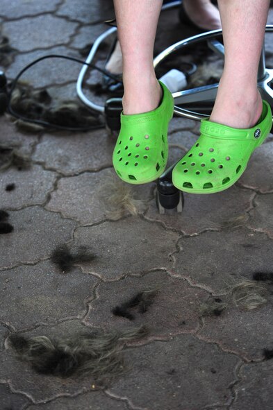 Jacob Torres, 7, son of U.S. Air Force Major Christopher Torres 603rd Air and Space Operations Center deputy chief of operations, has his head shaved in participation of the first ever St. Baldrick's event held on Ramstein Air Base, Germany, June 26, 2010. The St. Baldrick's Foundation is an organization that tasks volunteers with getting sponsored to have their heads shaved as a demonstration of their camaraderie to children that have been diagnosed with cancer. (U.S. Air Force photo by Staff Sgt. Jocelyn Rich)