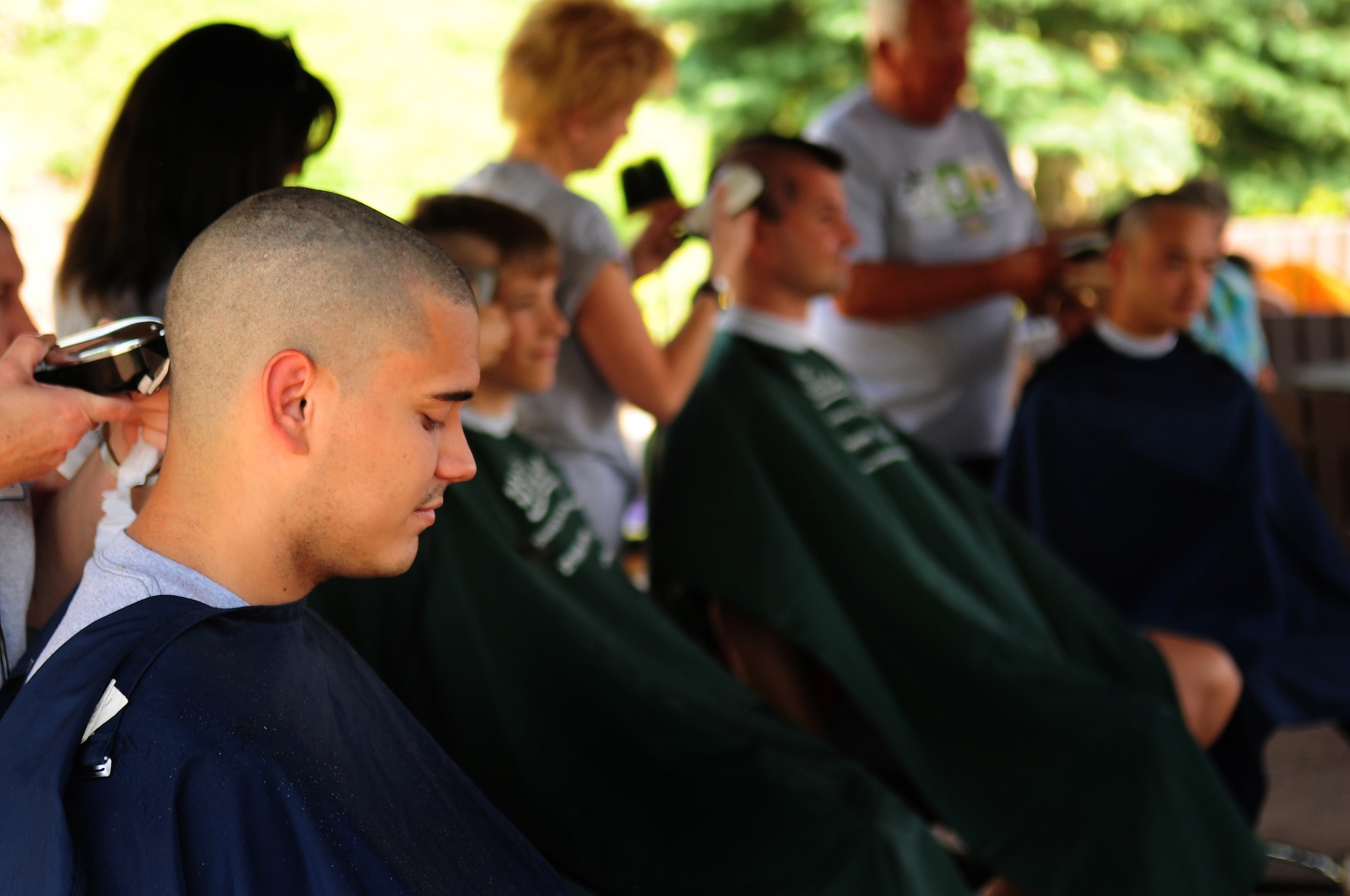 U.S. Air Force Senior Airman Miguel Mascorro, 86th Maintenance Squadron, has his head shaved as he participates in the first St. Baldrick's event held on Ramstein Air Base, Germany, June 26, 2010. The St. Baldrick's Foundation is an organization that tasks volunteers with getting sponsored to have their heads shaved as a demonstration of their camaraderie to children that have been diagnosed with cancer. (U.S. Air Force photo by Staff Sgt. Jocelyn Rich)