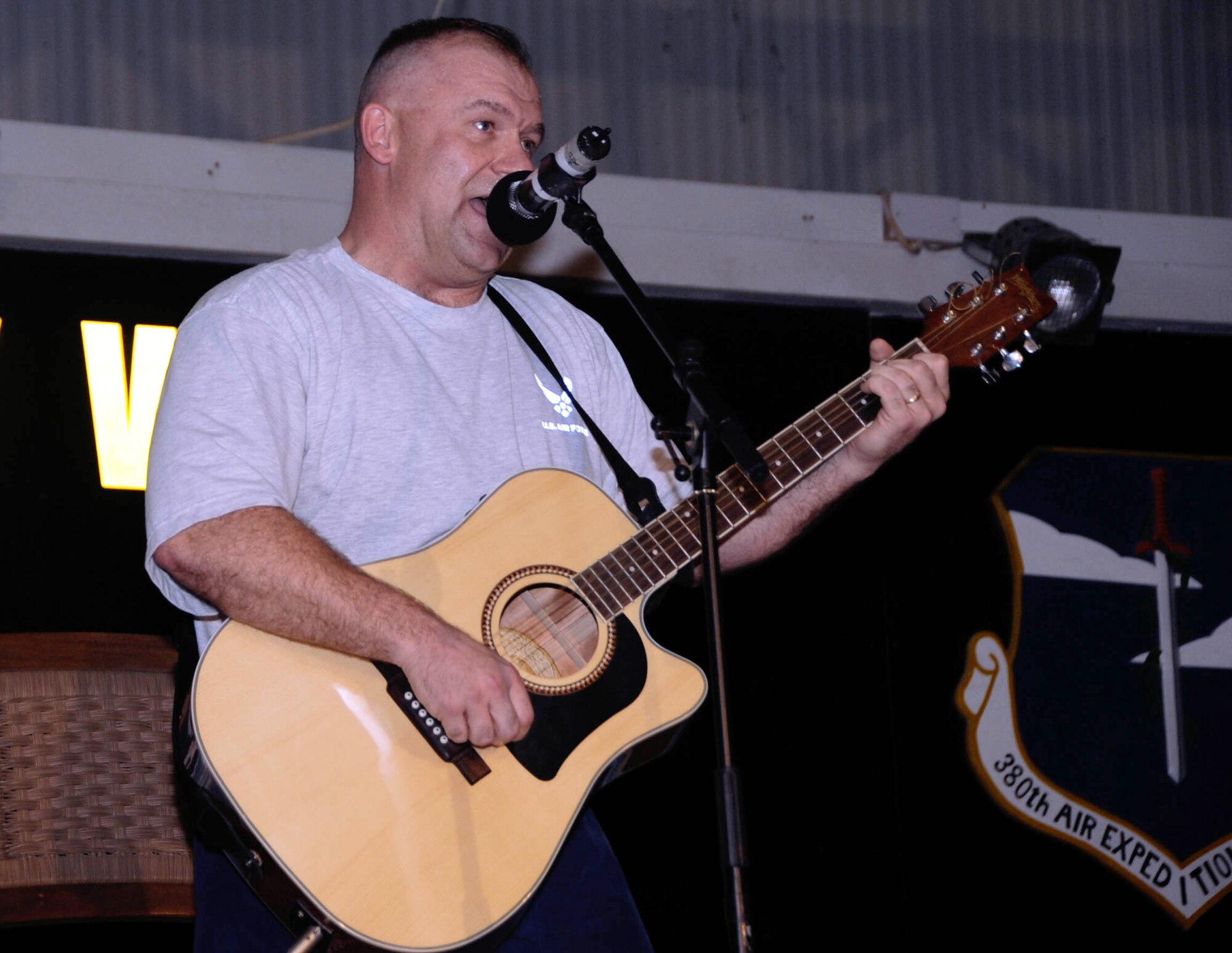 SOUTHWEST ASIA -- Senior Master Sgt. Robert Martin; 380th Expeditionary Civil Engineer Squadron first sergeant; secured first place in the 380th Air Expeditionary Wing's version of American Idol held here June 25. The contest was the first of its kind at the base; hosted by the First Four organization; in conjunction with several other base agencies. The top three winners received prizes provided by the Army and Air Force Exchange Service. (U.S. Air Force photo/Capt. Jessica Martin)