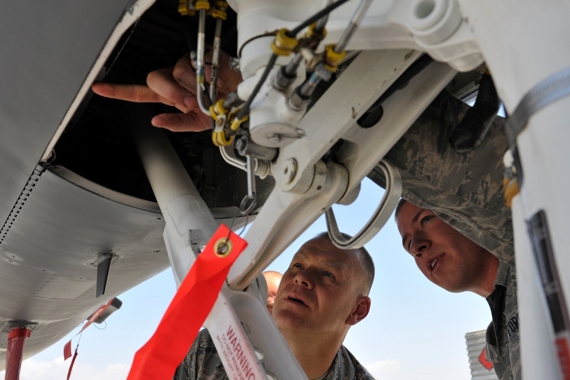 Chief Master Sergeant of the Air Force James A. Roy receives a tour of an F-15E Strike Eagle from Airman 1st Class Jordan Baker at Bagram Airfield, Afghanistan, June 25th 2010. Airman Baker is an Strike Eagle crew chief assigned to the 455th Expeditionary Maintenance Group and is a native of Adair, Kentucky. (U.S. Air Force Photo/Staff Sgt. Christopher Boitz)