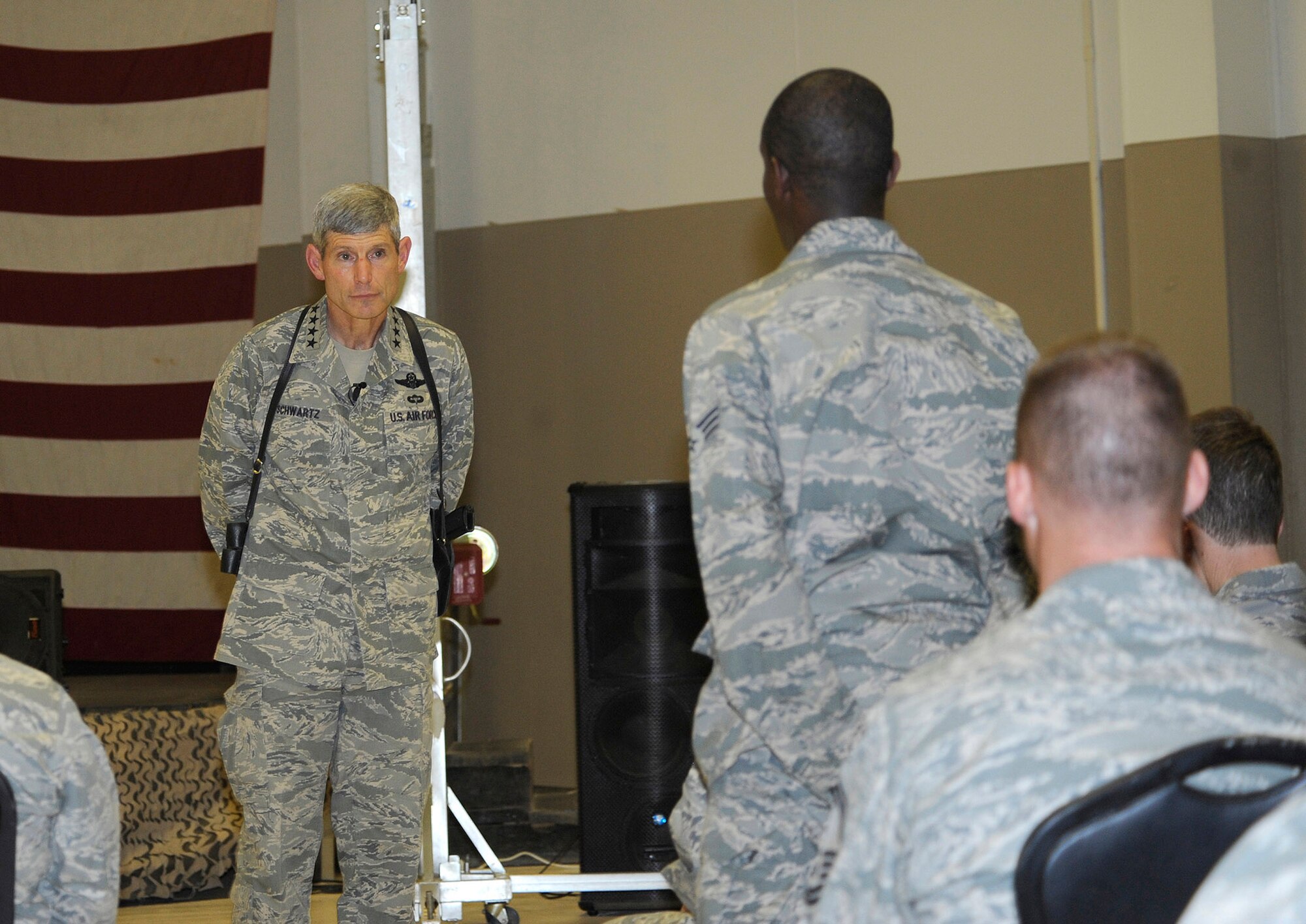Gen. Norton Schwartz, Chief of Staff of the Air Force, listens to a question by Senior Airman Christopher Powell, 732nd Air Expeditionary Group, executive administrator, during a visit here June 24, 2010.  General Schwartz discussed Air Force priorities and took questions from members of the 332nd Air Expeditionary Wing during the meeting. (U.S. Air Force photo/ Senior Airman Matt Coleman-Foster)