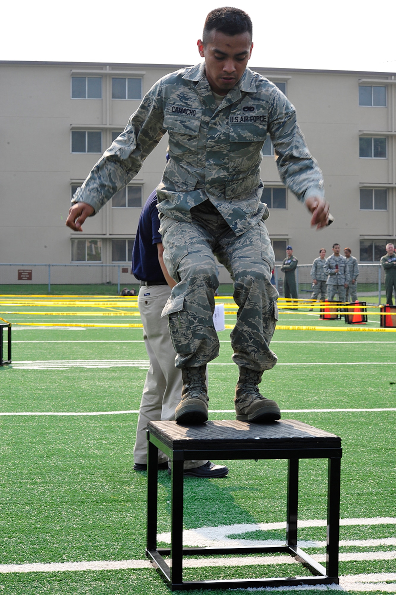 Senior Airman Alfredo Camacho, 51st Maintenance Squadron, completes one foot box jumps during a Warrior Challenge competition, put on by the Osan Fitness Center. Throughout the competition four teams were timed as they completed several physical tasks. The team with the fastest time won trophies for each of its members. (U.S. Air Force photo/ Staff Sgt. Eunique Stevens)