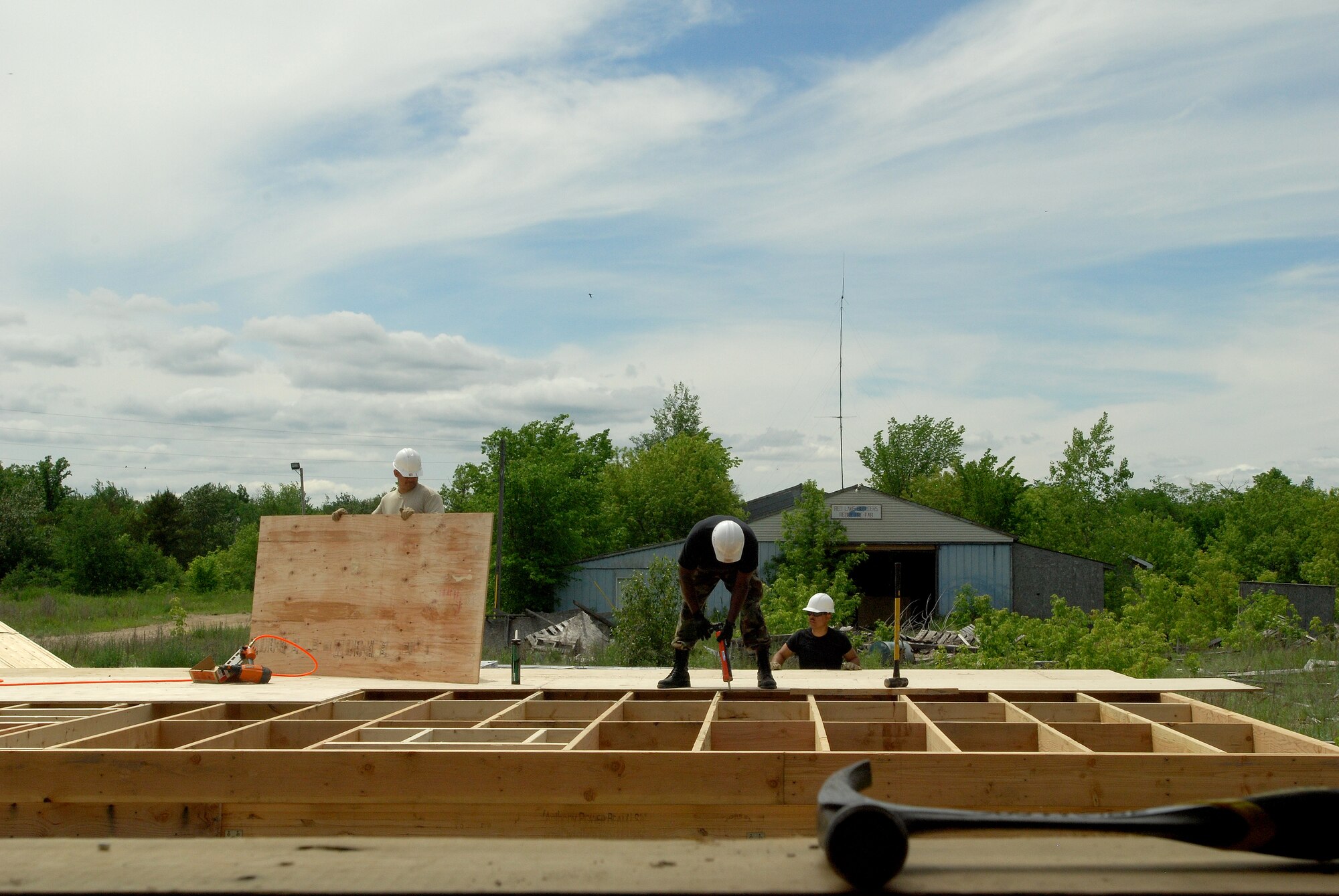 Members of the 433rd Civil Engineering Squadron conduct a humanitarian mission in the Red Lake Indian Reservation for the Red Lake band of Chippewa Indians, just outside of Bemidji, Minnesota. Building the subfloor of what will become a two-bedroom home.(U.S. Air Force photo/Airman 1st Class Brian McGloin)